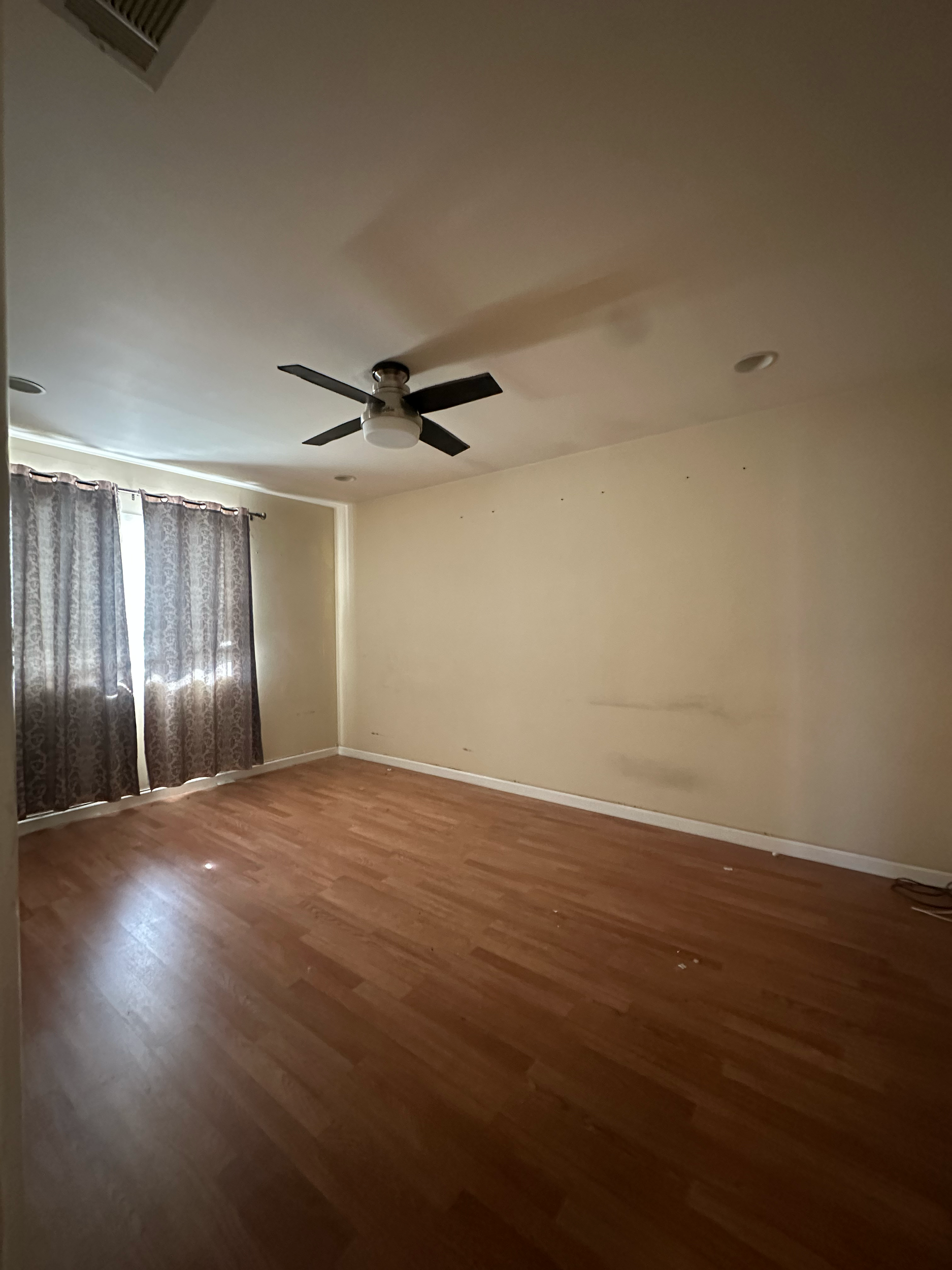 Lighter paint color to open up and brighten the room.