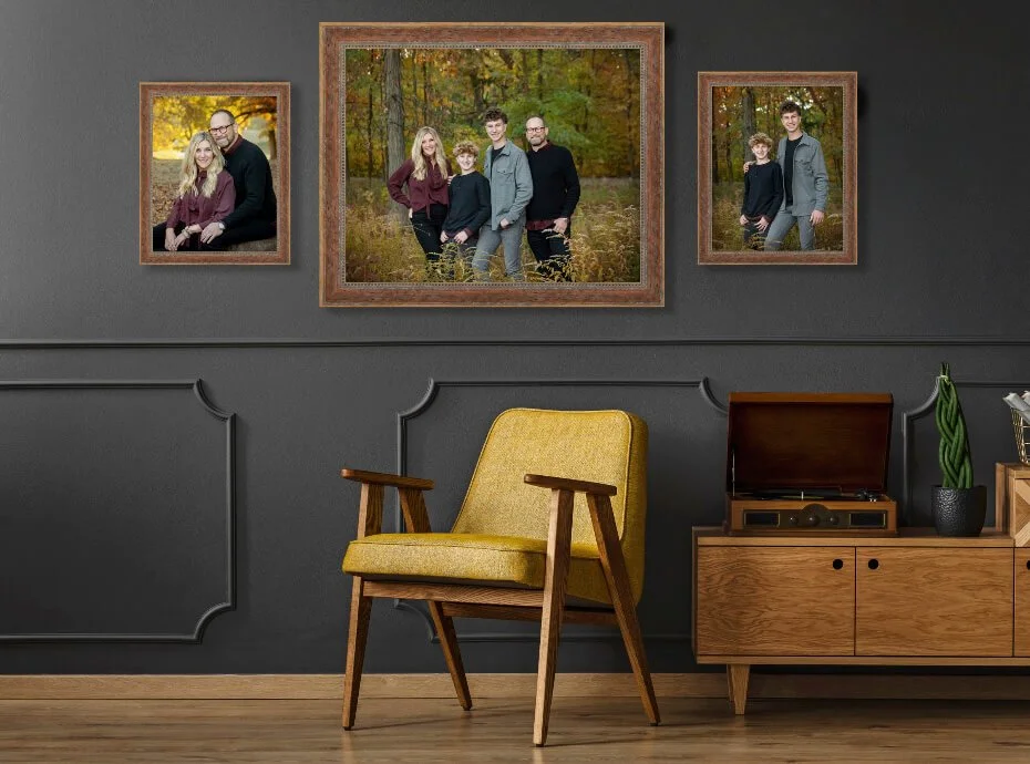 3 piece framed family wall art on a dark charcoal wall with a yellow chair