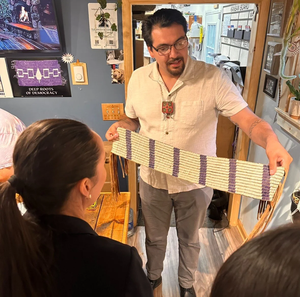 Brennen Ferguson explaining the Tuscarora Taken In Wampum to US Secretary of the Interior Deb Haaland and Staff during a visit to Tuscarora WoodWorks in 2024