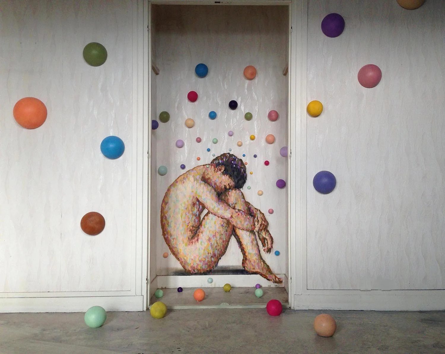 Man with spheres for website.jpg