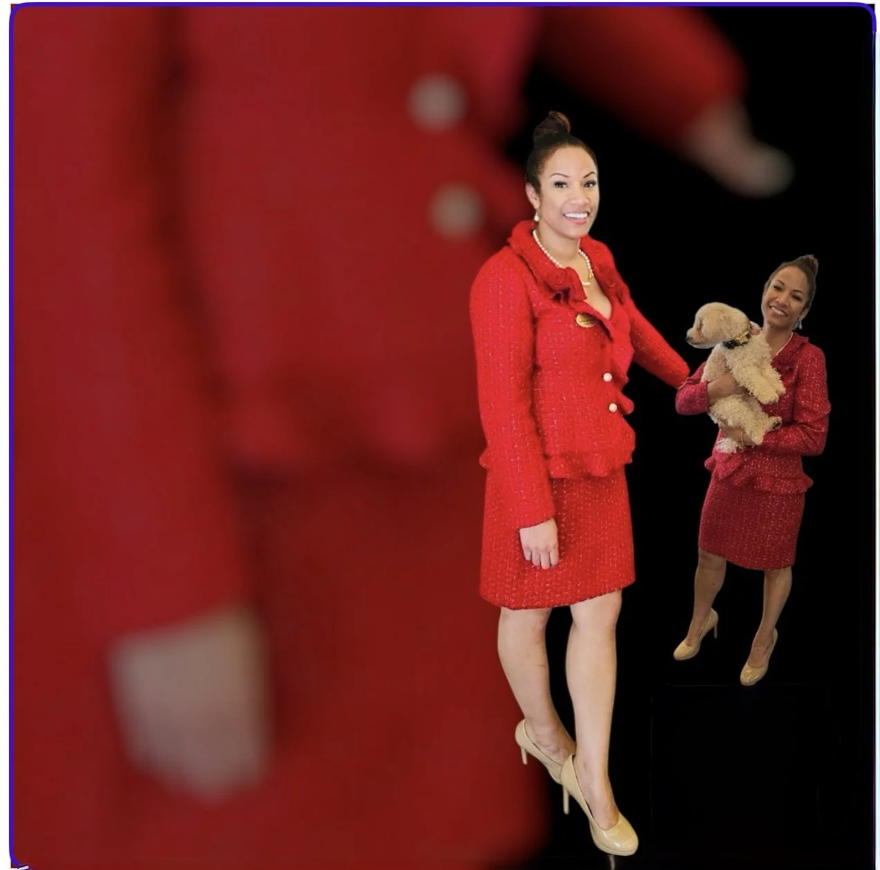 A woman dressed in a red skirt and jacket, wearing beige high heels, standing and smiling. Another woman, also in red, holding a small beige dog, is in the background. The background is black with some red elements.