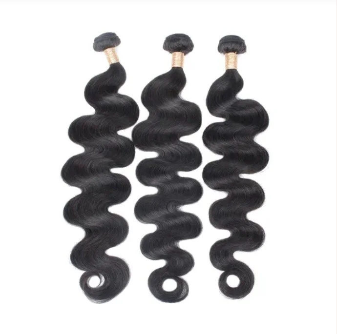Three bundles of black wavy hair extensions with silk ties at the top.