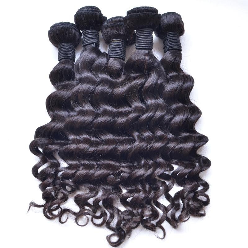 Four bundles of dark brown, wavy, curly hair extensions laid out side by side on a white background.