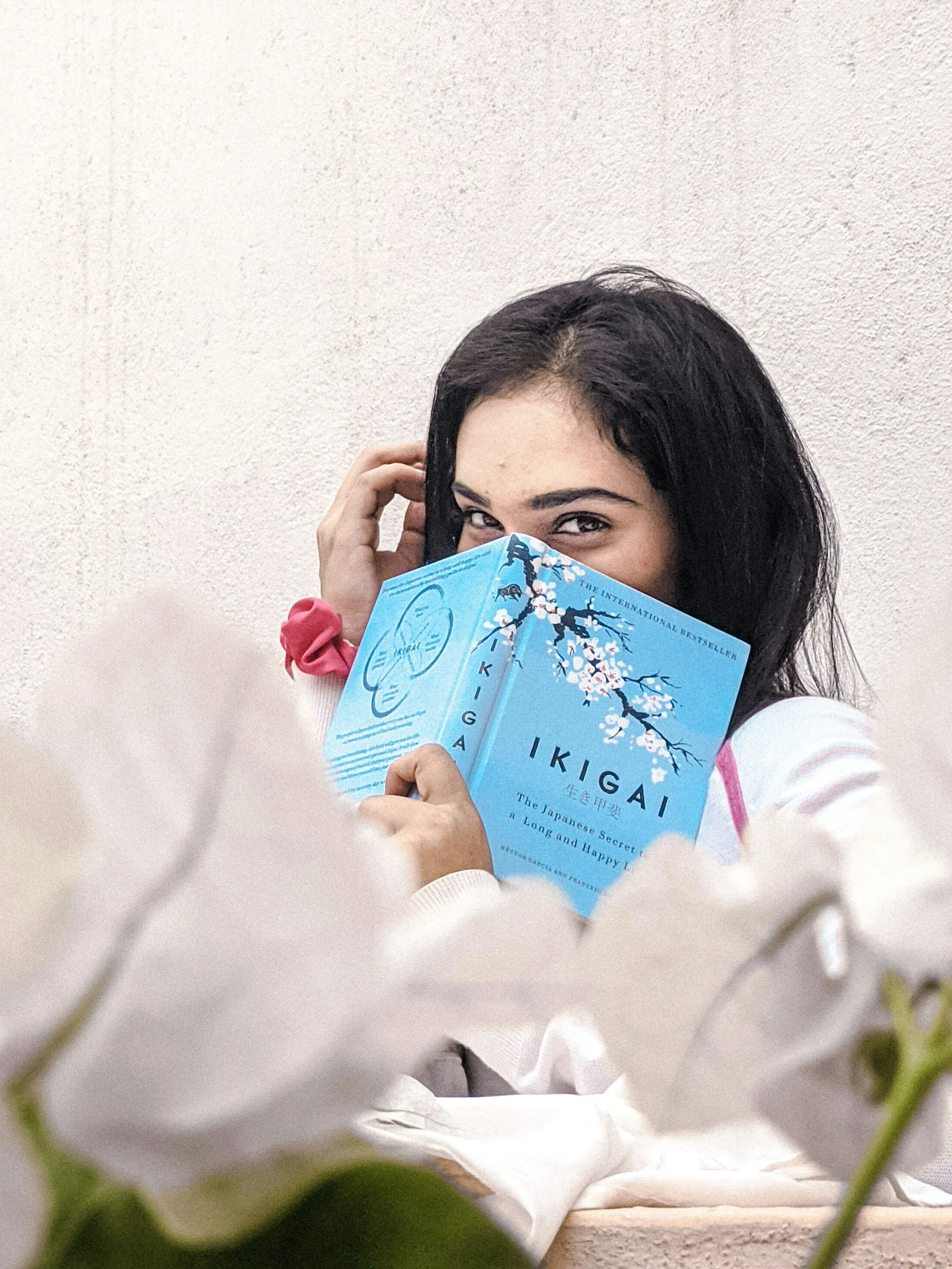 woman reading ikigai the japanese secret to a long and happy life