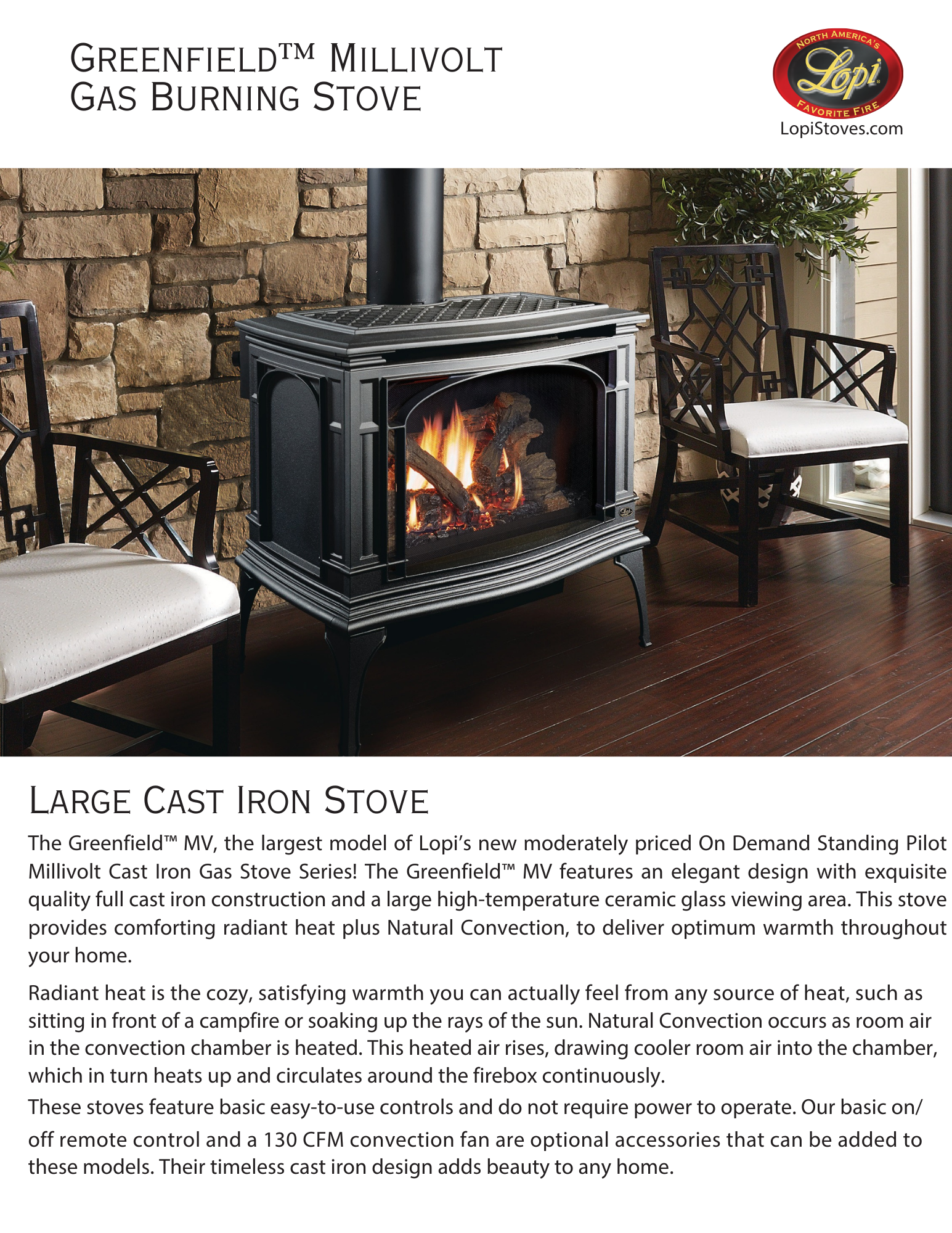 Lopi Greenfield MV gas stove in the middle of two chairs against a rock wall