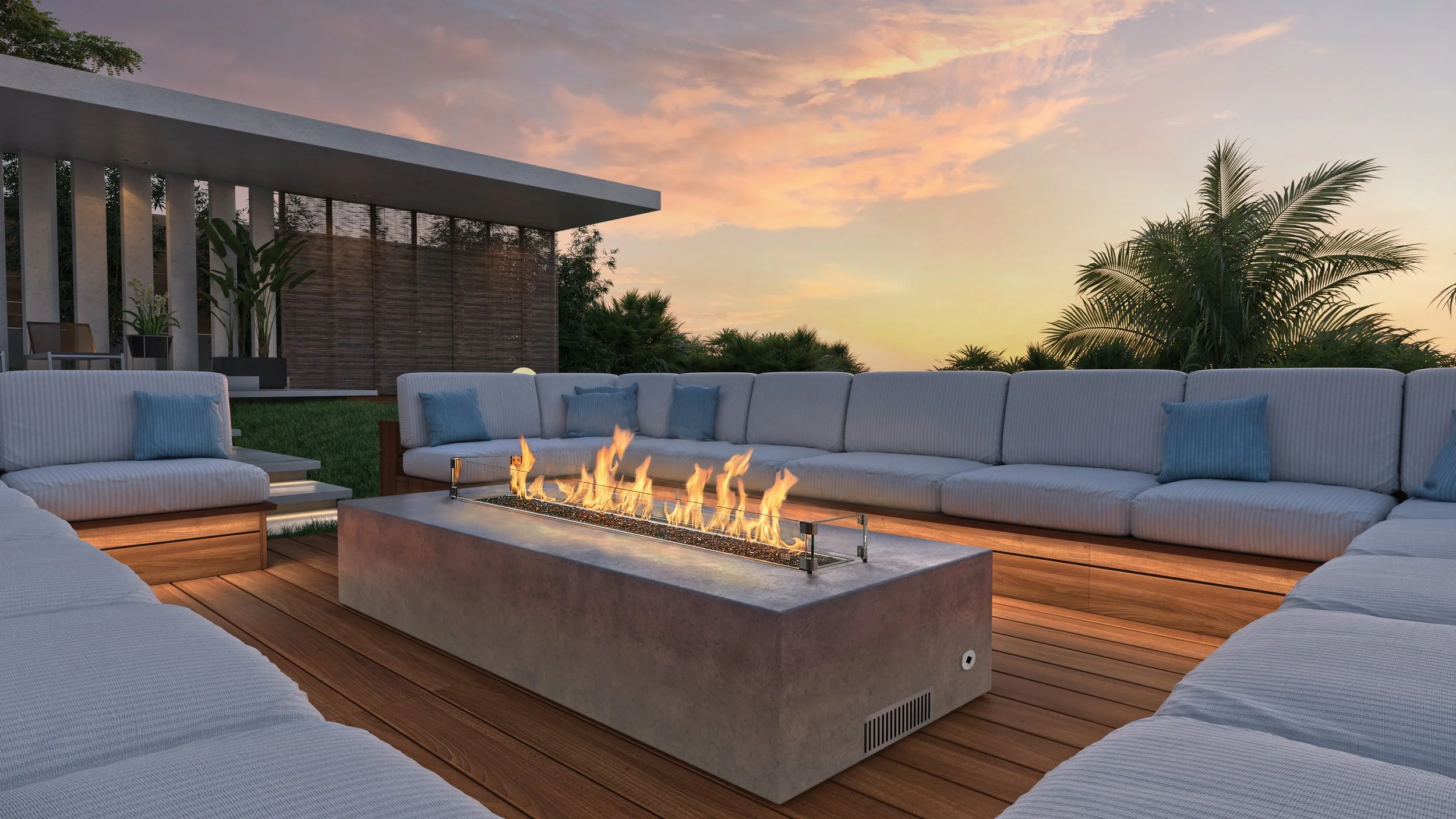 an outdoor gas firepit with couches around it