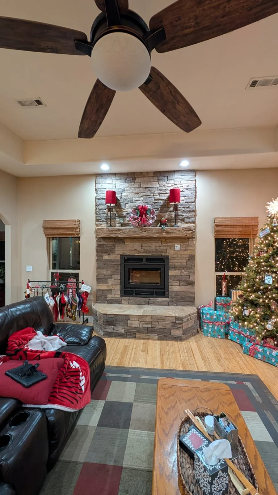 Finished fireplace wide living room view