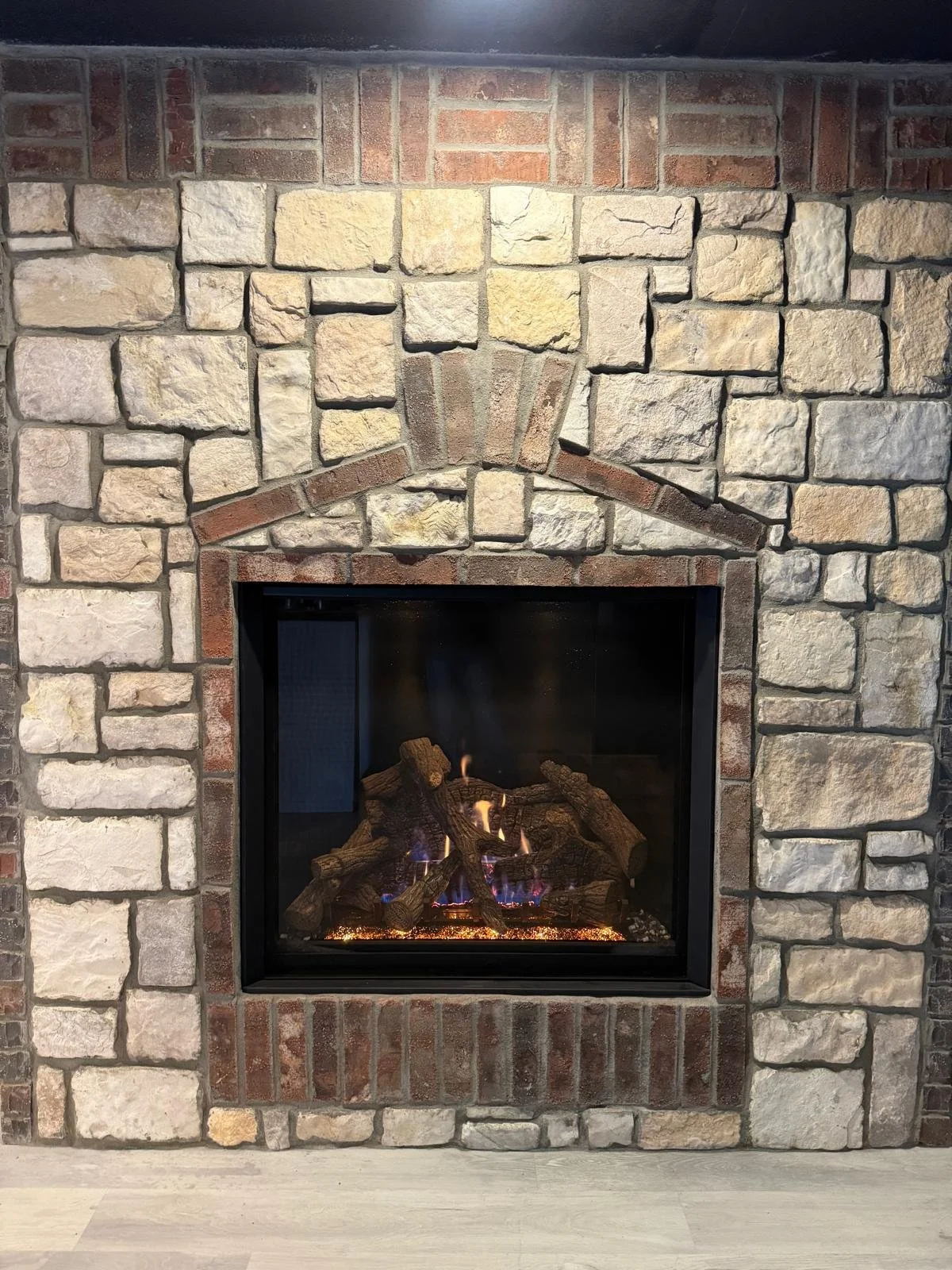close-up photo of gas fireplace in a rock wall