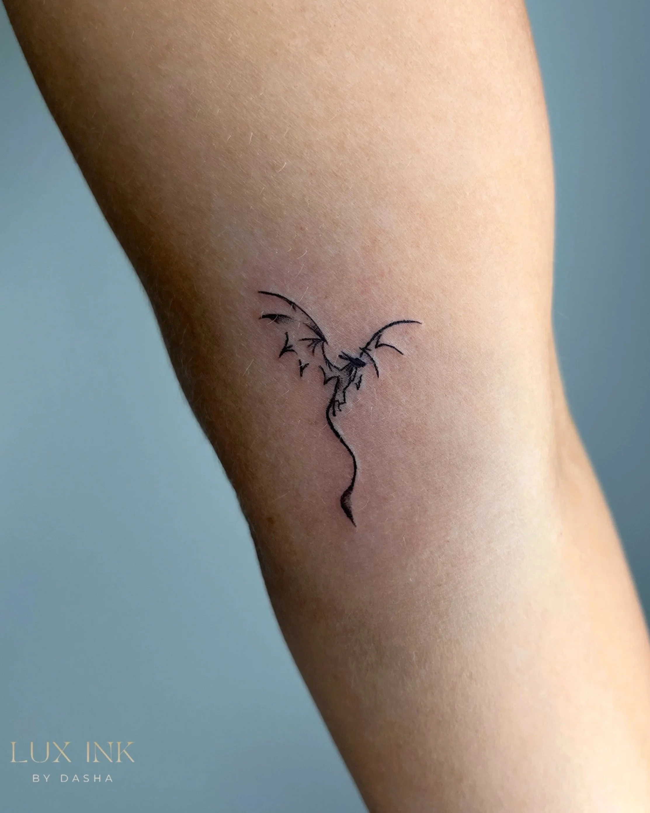 Dragon mini tattoo in Lux Ink by Dasha.