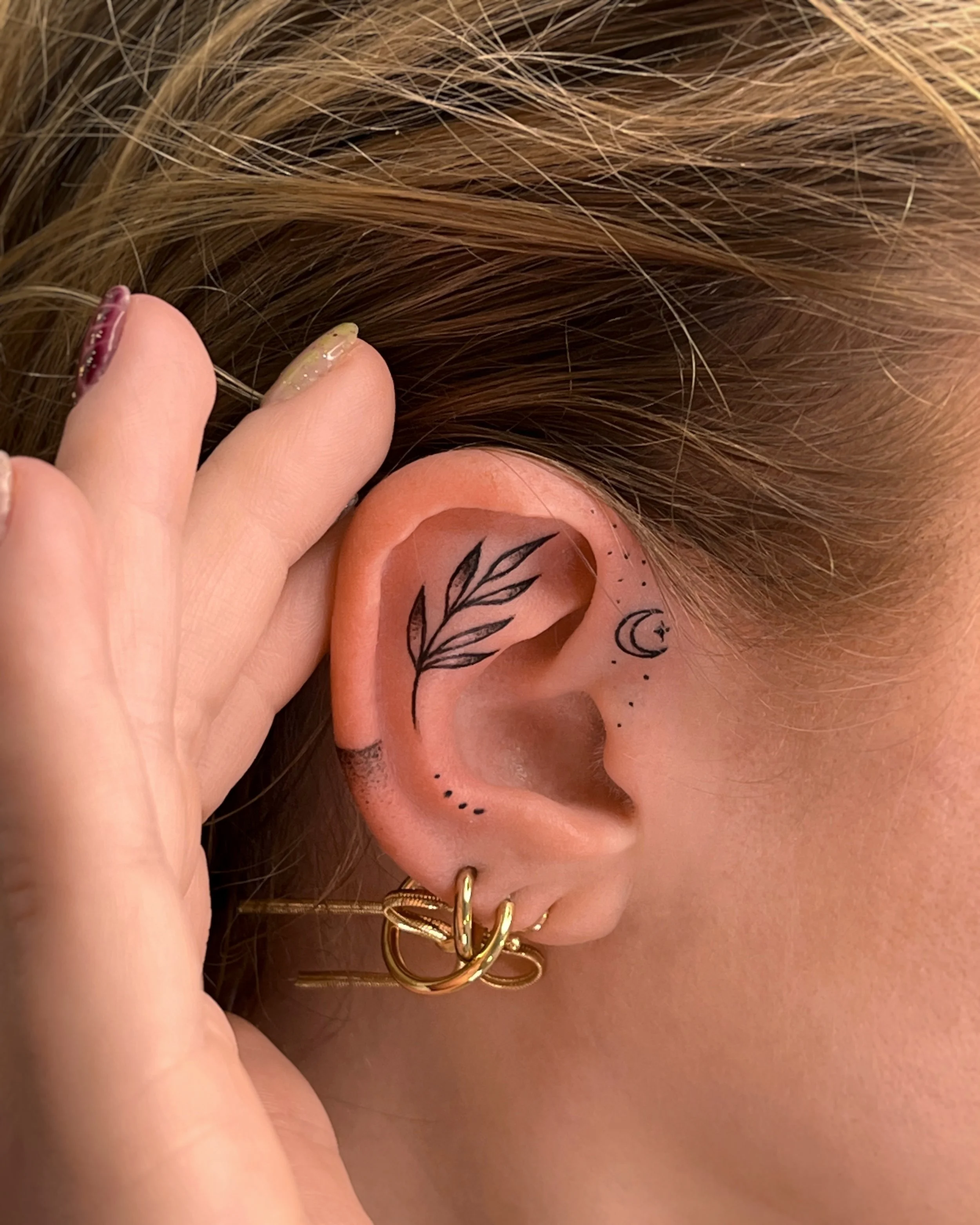 Ear tattoo in Savannah