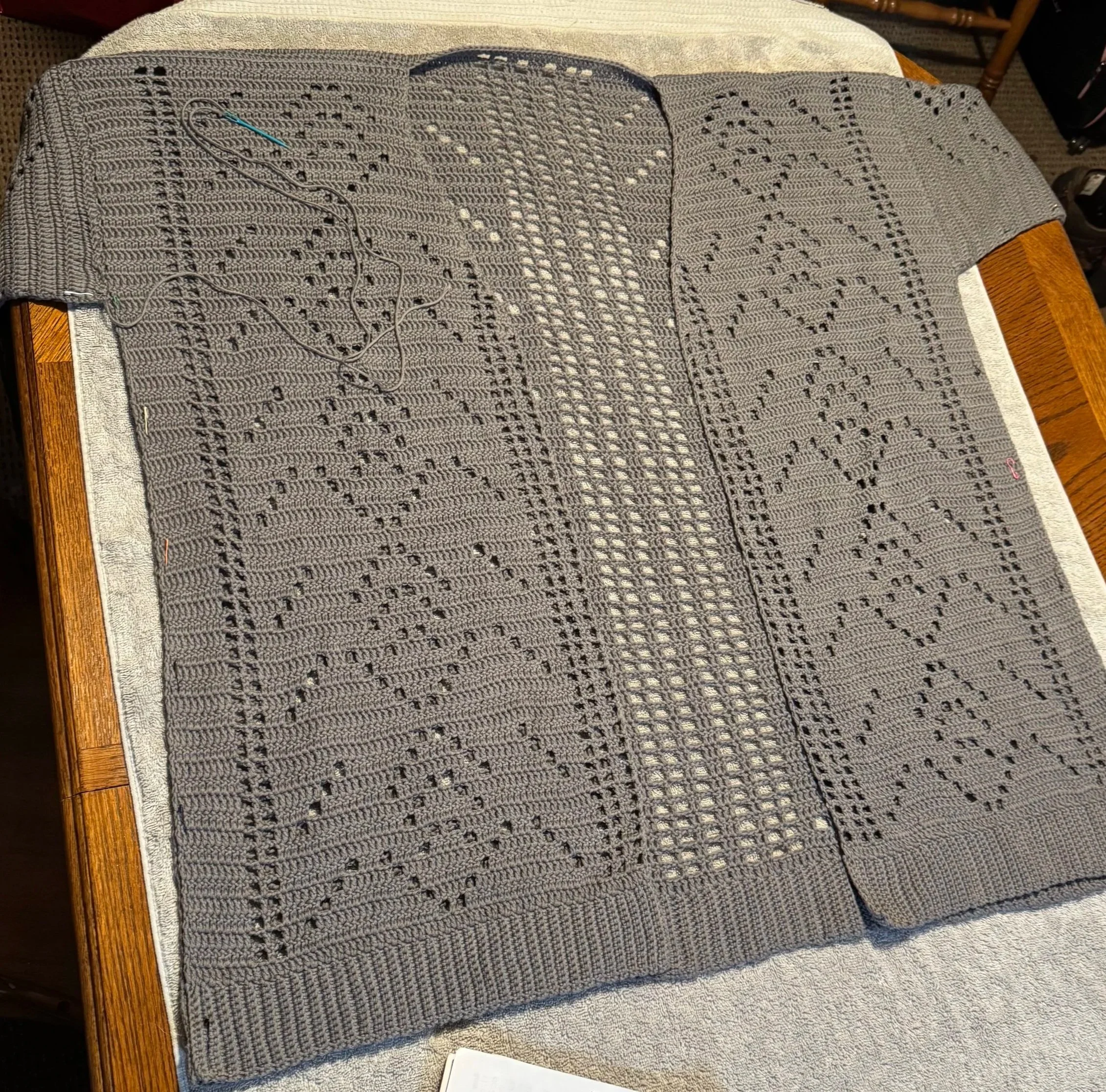 A crocheted cardigan; sister pattern to the teal knit cardigan