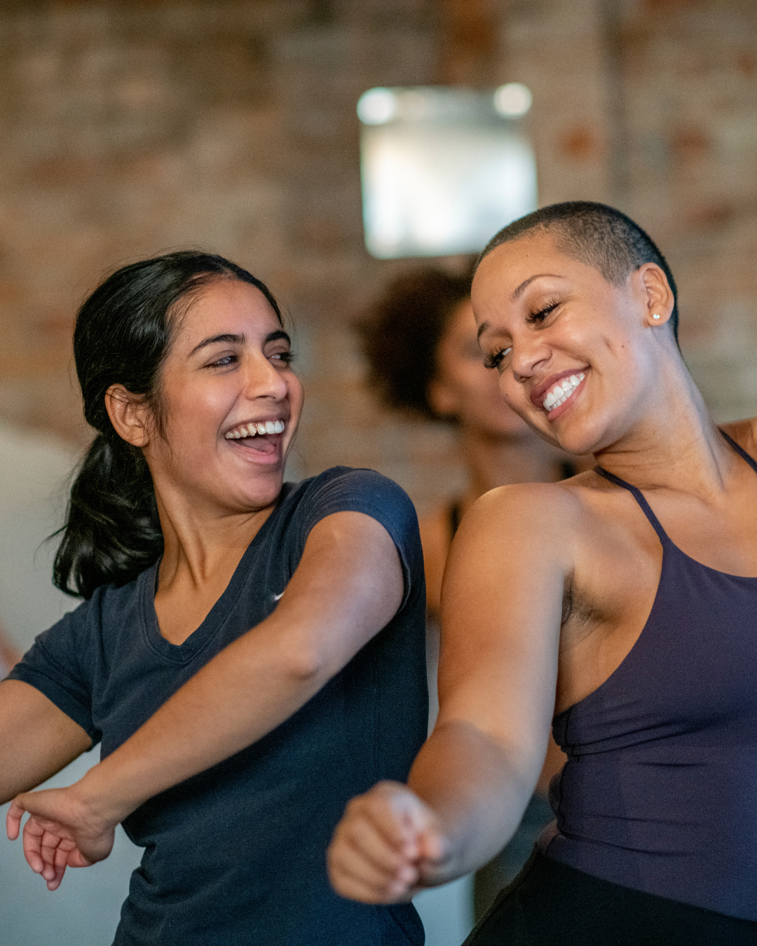 People in relaxed movement practice, symbolizing somatic engagement