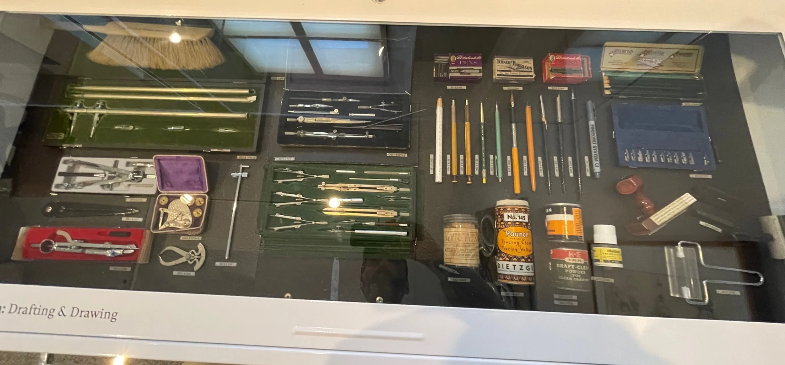 A drawer displaying the tools and implements of an architectural draftsman.