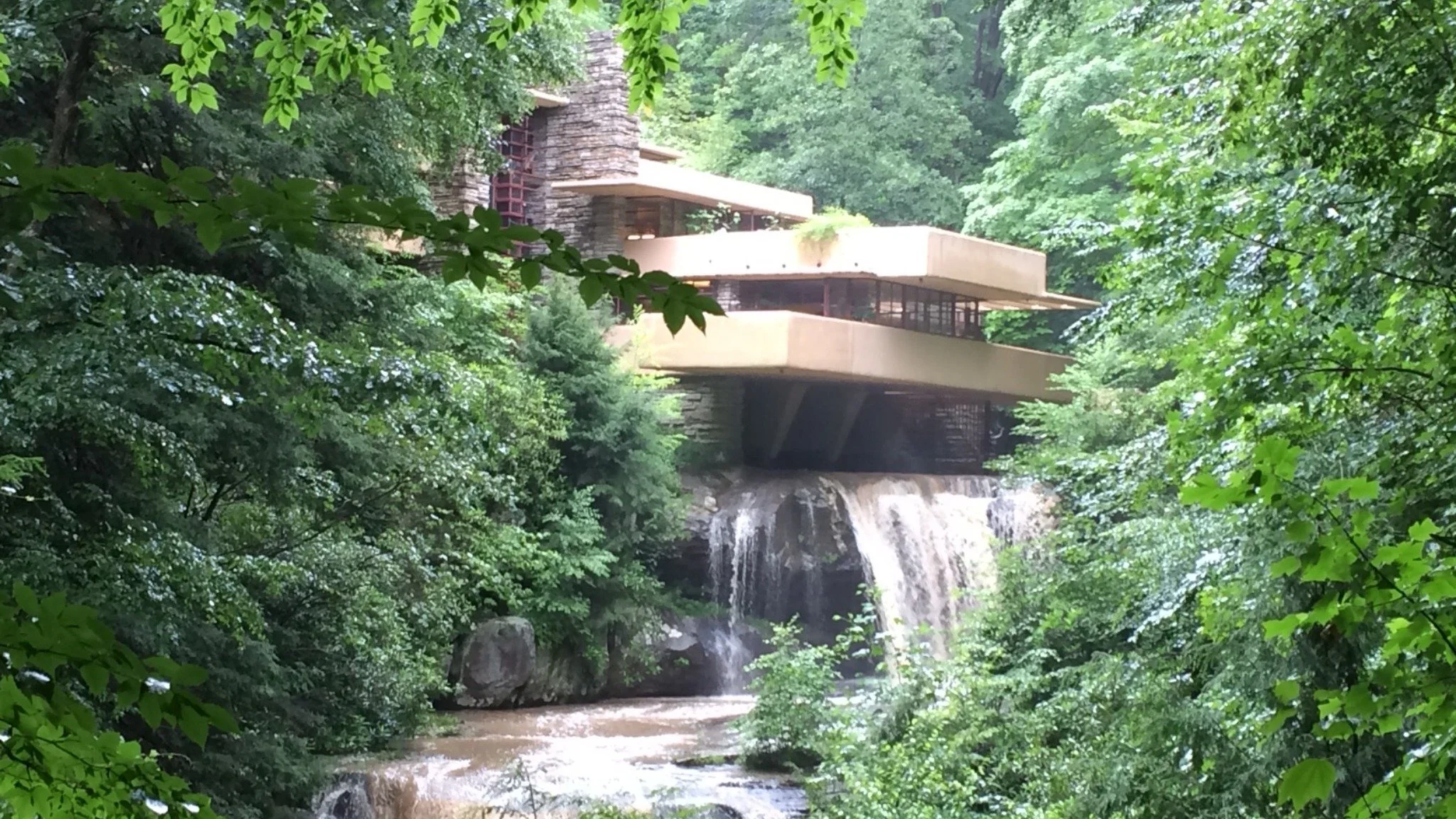 A home situated over a waterfall.