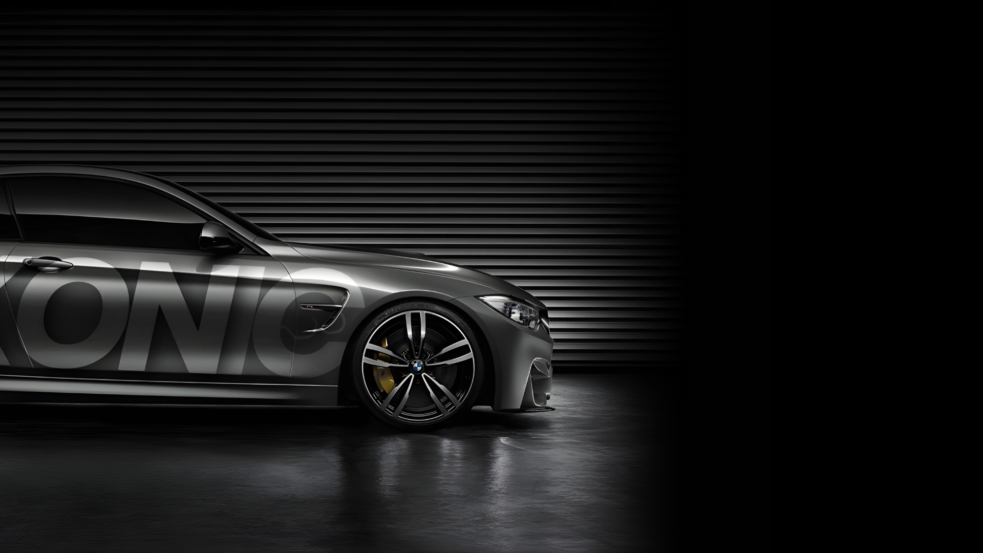 A sleek, black BMW F82 M4 by Ikonic Styling