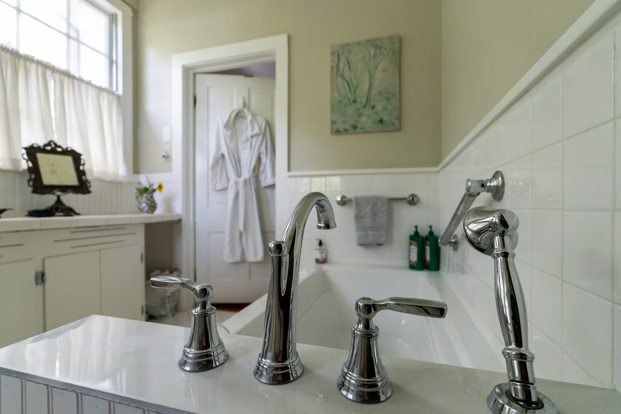 Upstairs master bathroom. Relax in the deep soaking tub with a view of the sky and treetops.
