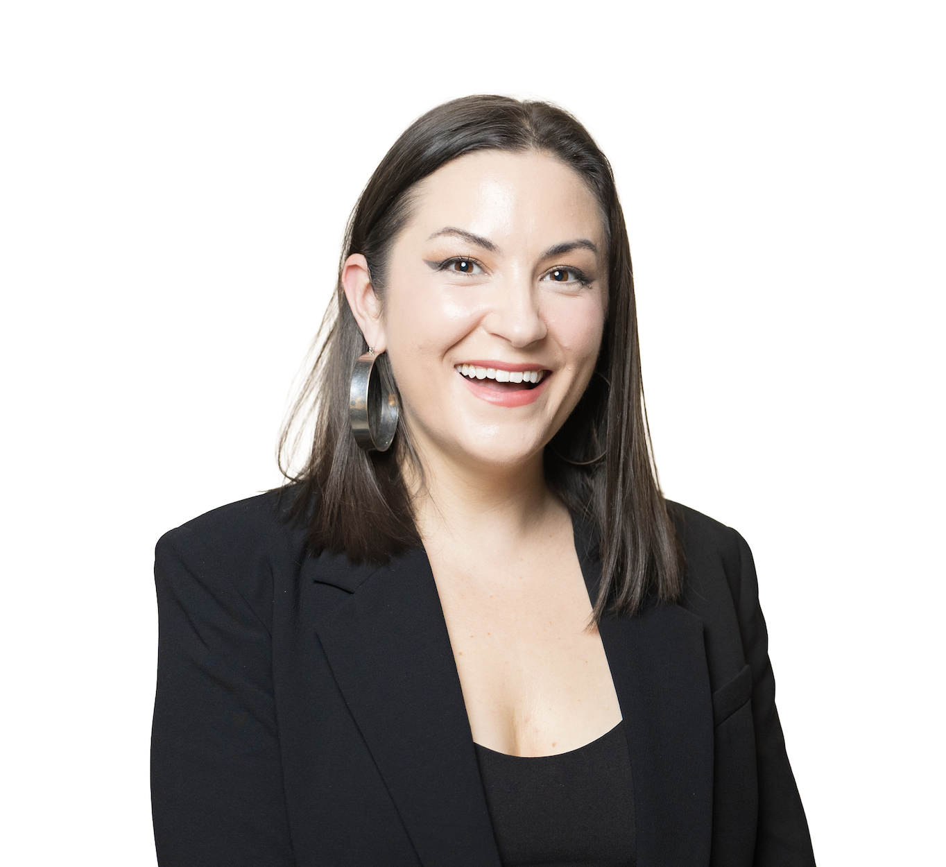 A woman with shoulder-length dark hair smiling, wearing a black blazer and large hoop earrings, against a plain white background.