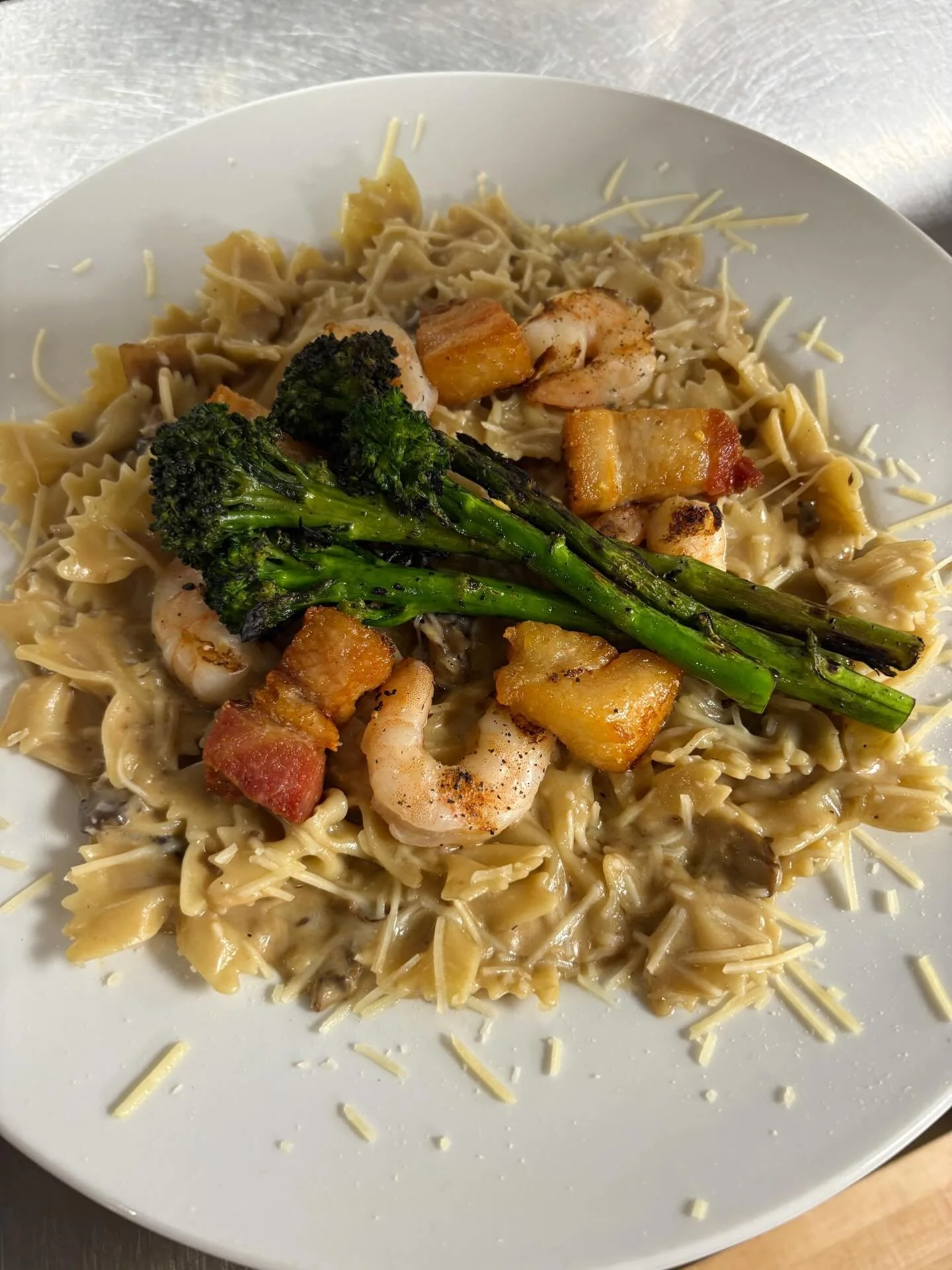 happy friday, columbia! we have one heck of a delicious special for you tonight! come enjoy a hearty plate of farfalle pasta in a dijon soy cream sauce with shrimp, mushroom &amp; charred broccolini, topped with fried pork belly pillows &amp; parmesa