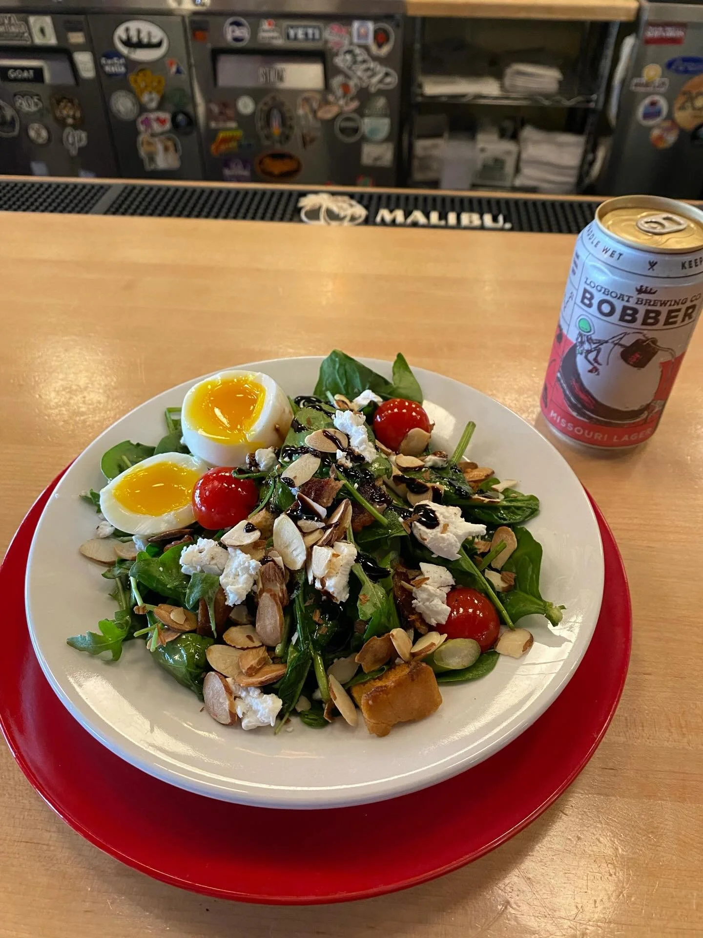 come in &amp; let us brighten your gloomy thursday with this gorgeous warm salad special! a delicious mix of wilted spinach &amp; arugula with bacon, green onion, tomato, hearts of palm, goat cheese, toasted almonds, croutons &amp; a perfectly soft-b