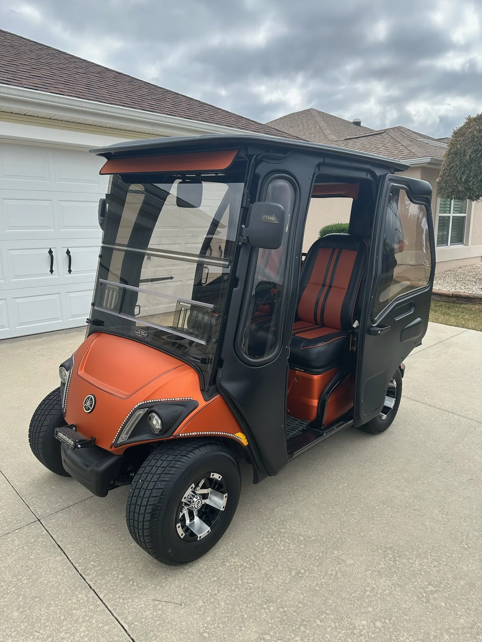 clean orange yamaha golf cart with doors