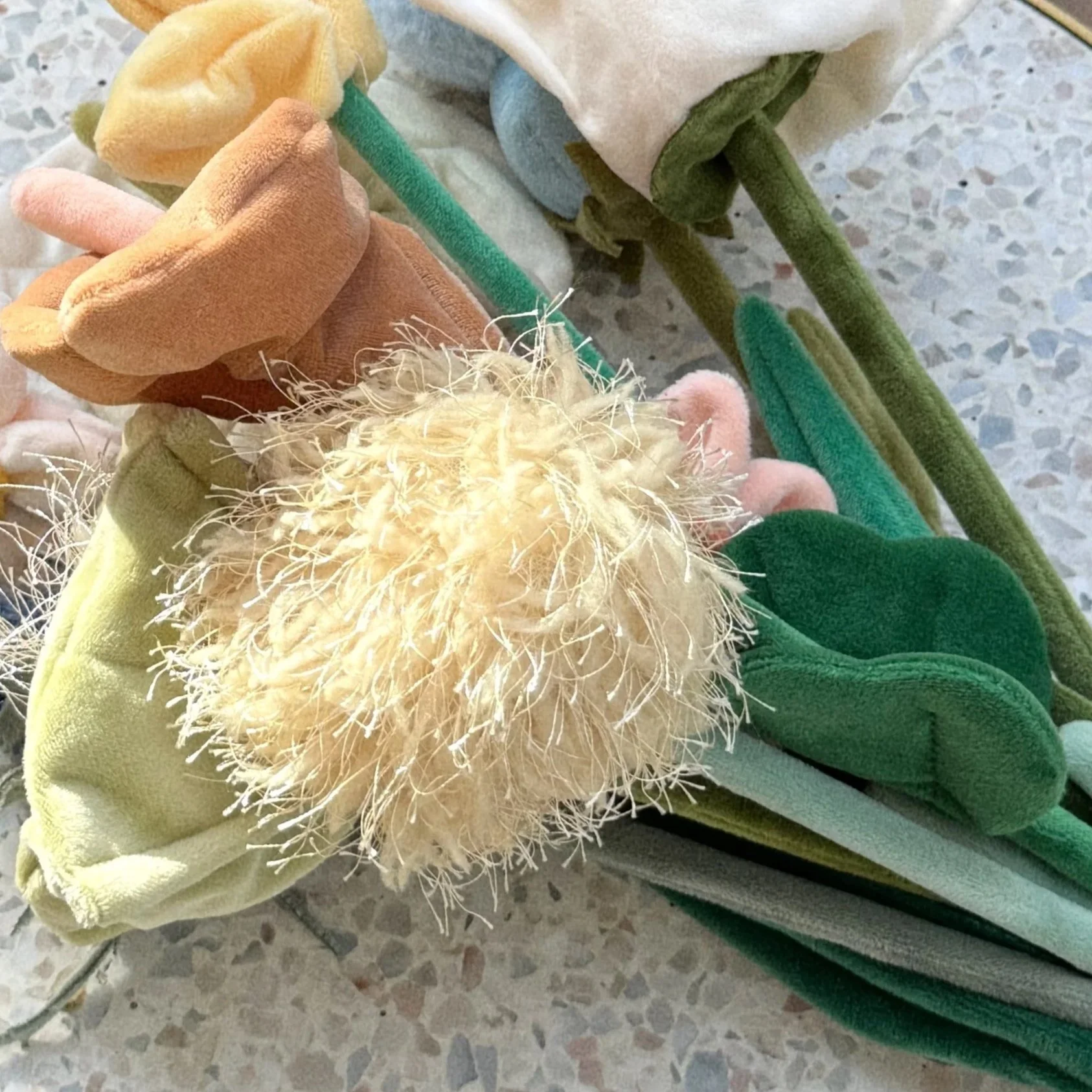 Close-up of handmade Banksia felt flowers from CJ Hendry’s immersive Flower Shop experience attended by Tuesday from Social Sync AU