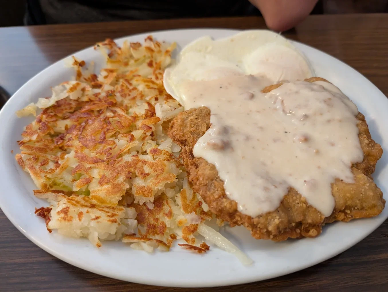 Jims By MLVS: Chicken Fried Steak: Plate of crispy chicken fried steak with white gravy, scrambled eggs, and hash browns.