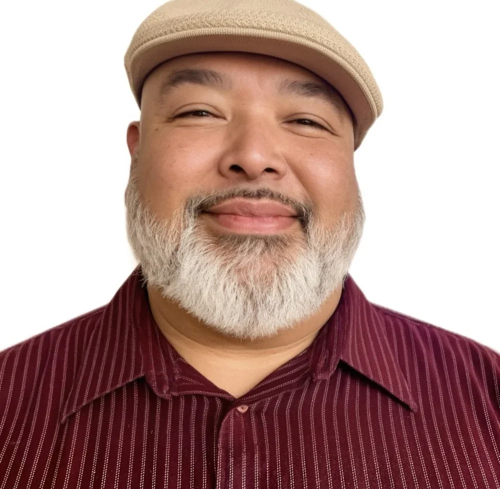MLVS Team: Mr. Edman Vargas, Medical Assistant (Medisoft) PC Instructor/MOA Instructor. A smiling man with a beard wearing a beige flat cap and a striped maroon shirt.