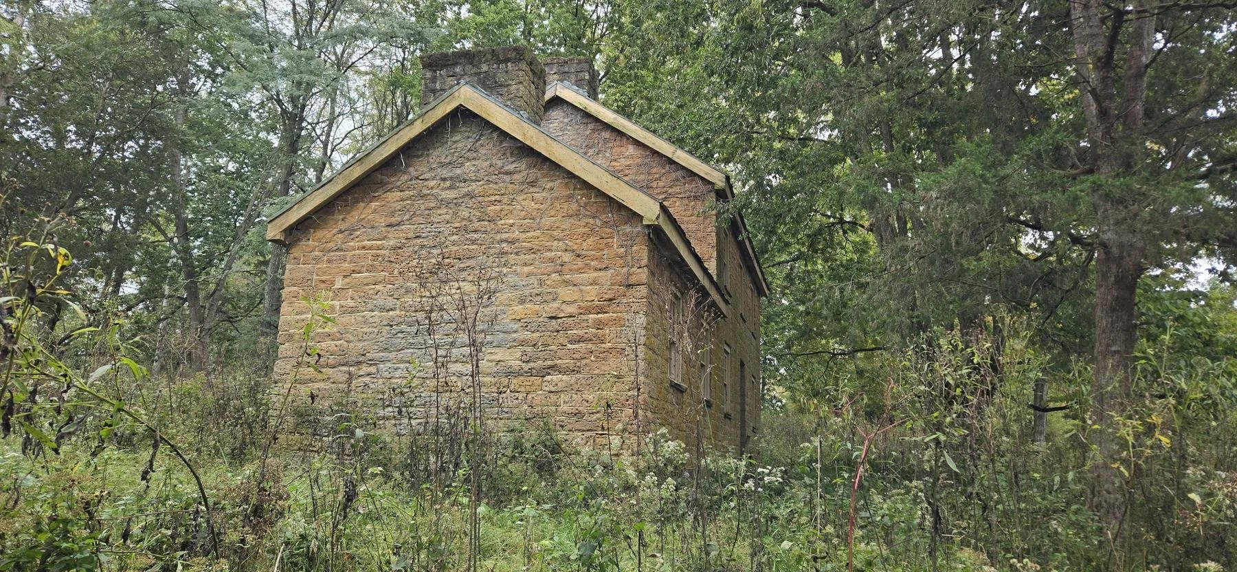  The gable end, with two chimneys. 