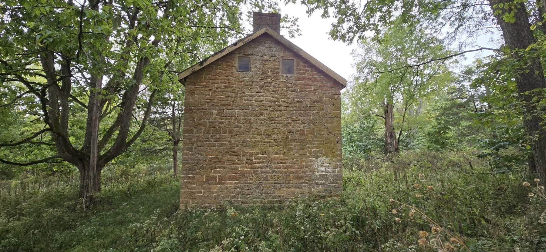  A gable wall, with two small attic windows. 