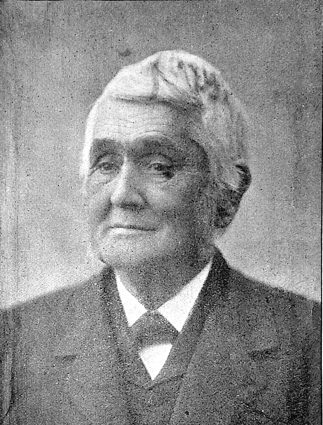 Photographic portrait of the Rev. Joseph Wright, an elderly man in a dark coat and vest, from an 1898 issue of The American Friend.