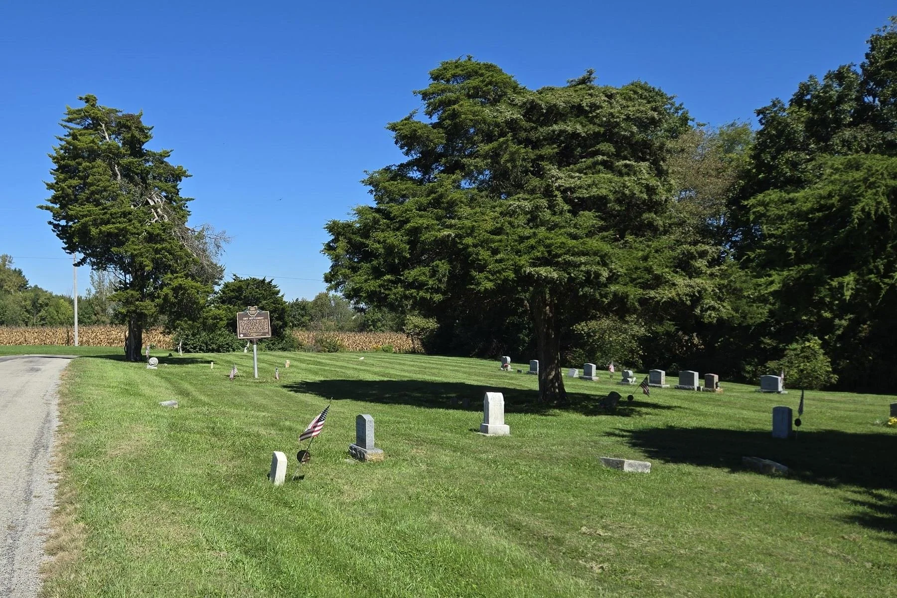 Gist Settlement Cemetery beside Gist Settlement Road in Penn Township, Highland County, Ohio, with Ohio Historical Marker 5-36 and rows of grave markers, photographed September 26, 2026.