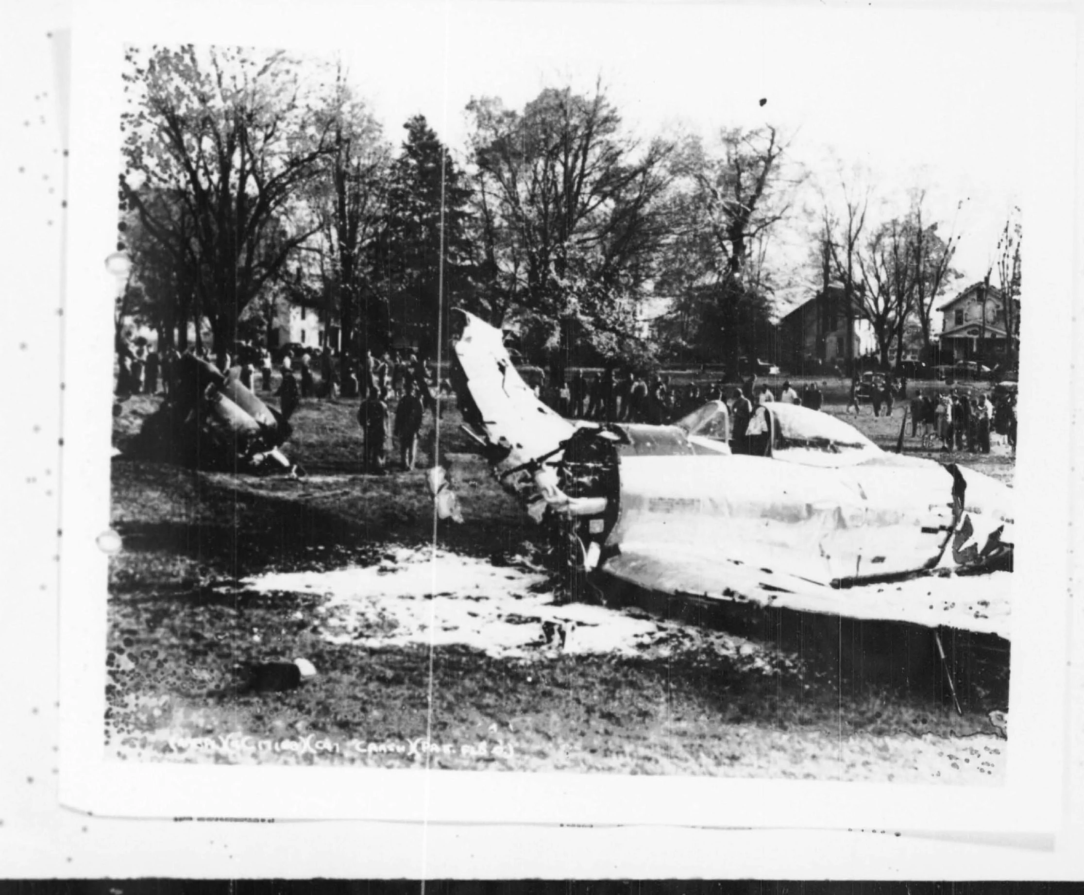 Onlookers ring a wrecked P-47 fighter on the Wilmington College campus, October 26, 1944.