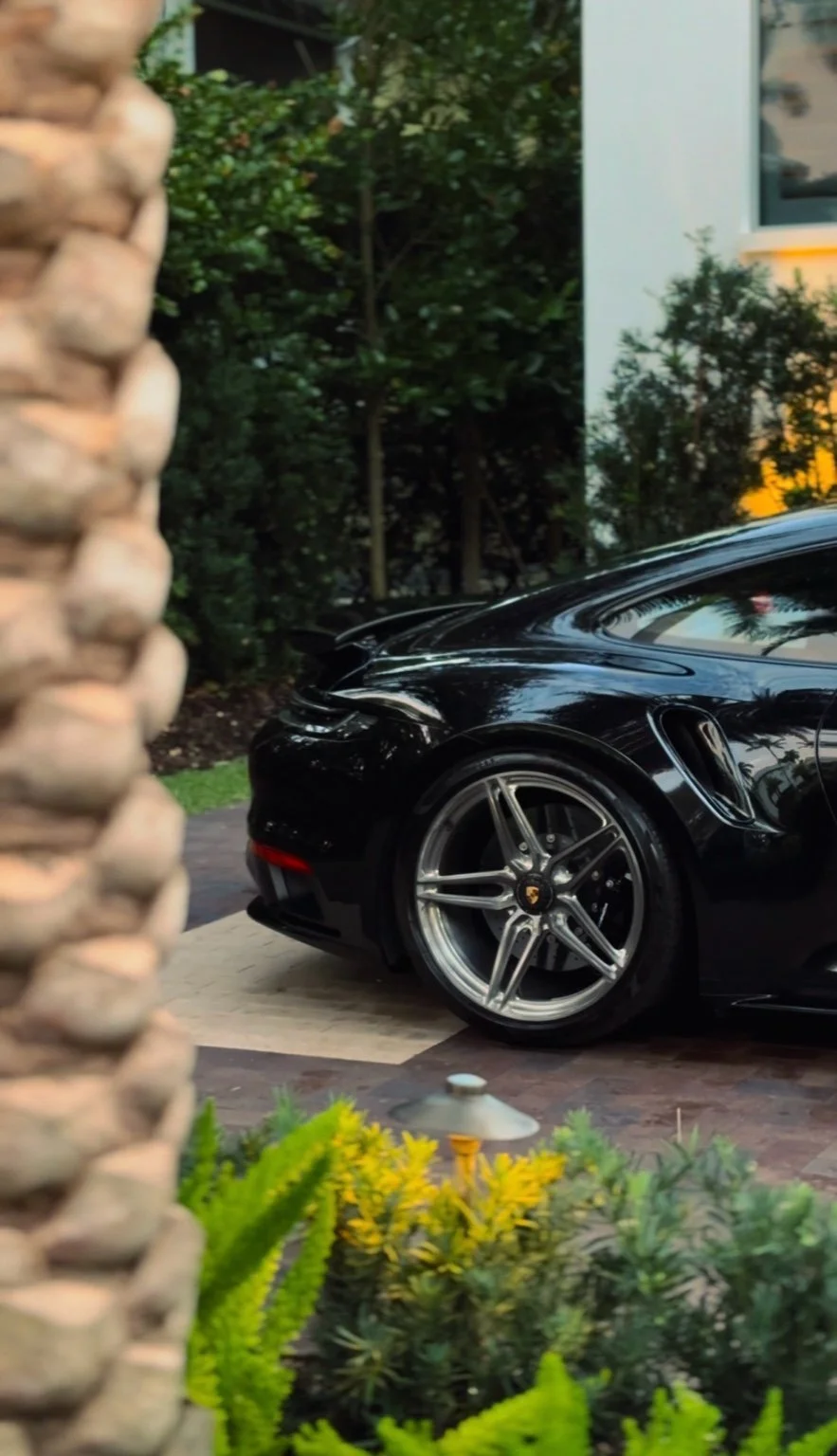 Porsche 911 Turbo S side profile after professional exterior detailing in Naples Florida