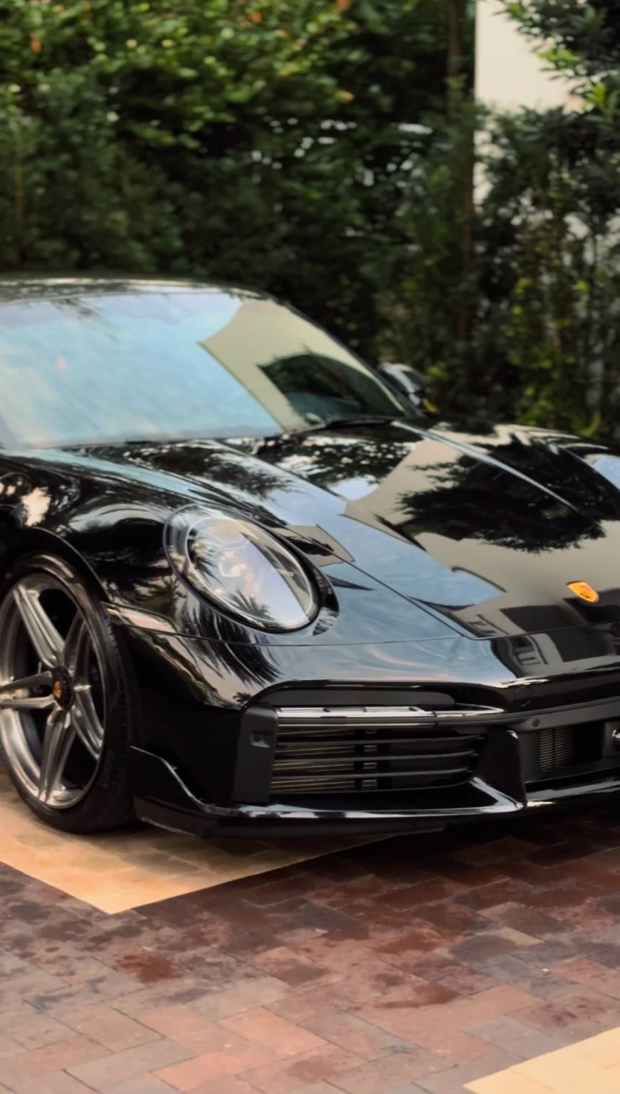 Porsche 911 Turbo S front end after paint correction and detailing in Naples FL