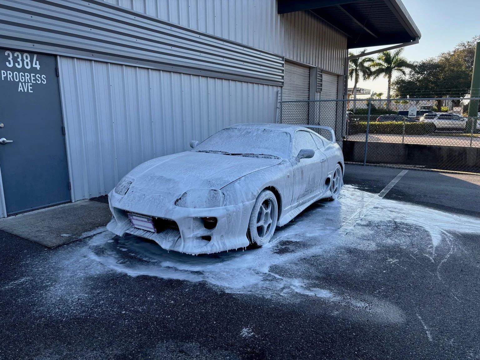 Toyota Supra covered in thick foam during pre-wash stage at BFA Detailing Naples FL