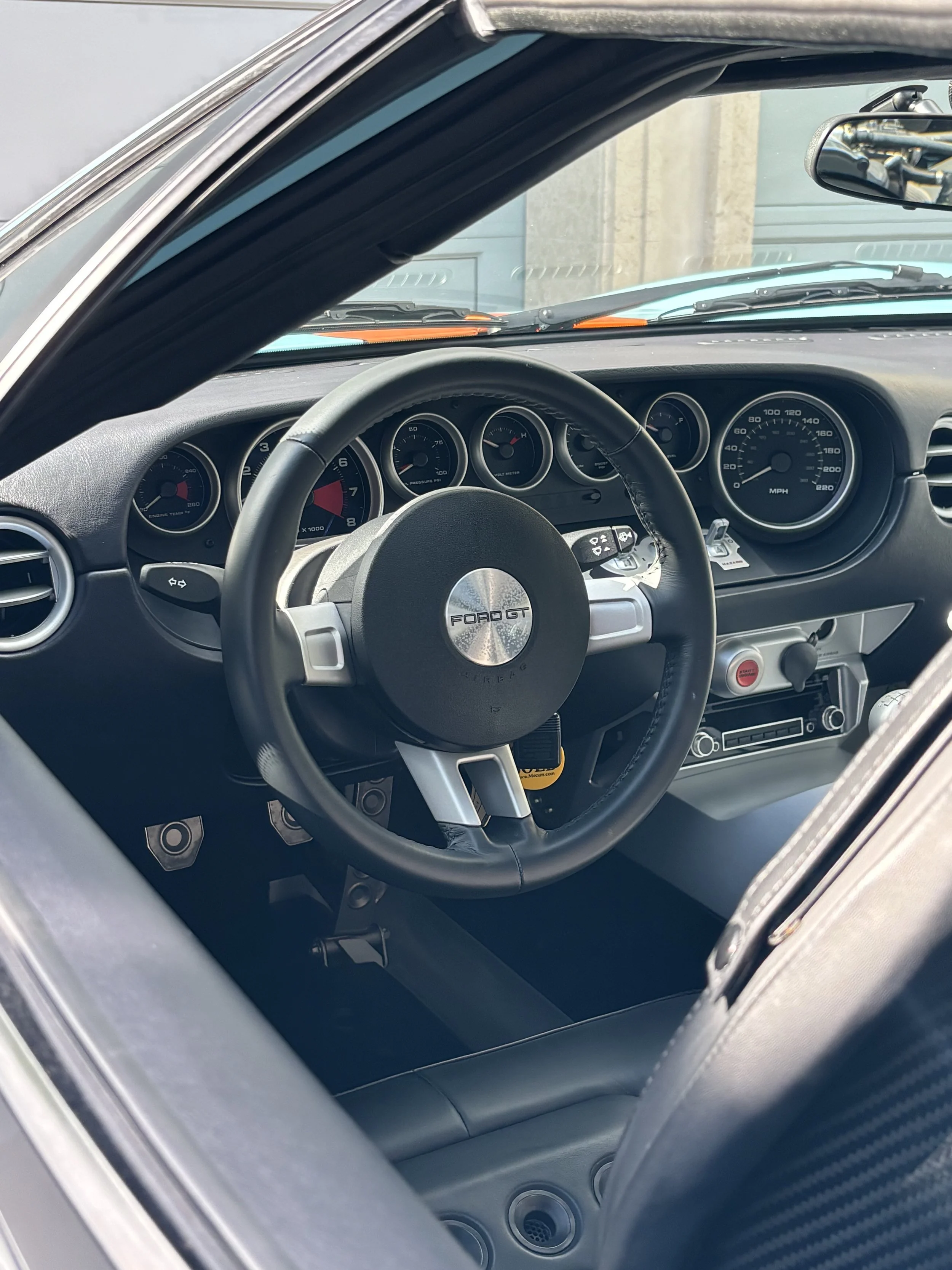 Interior detailing service in Naples FL – detailed cleaning of steering wheel and dashboard.
