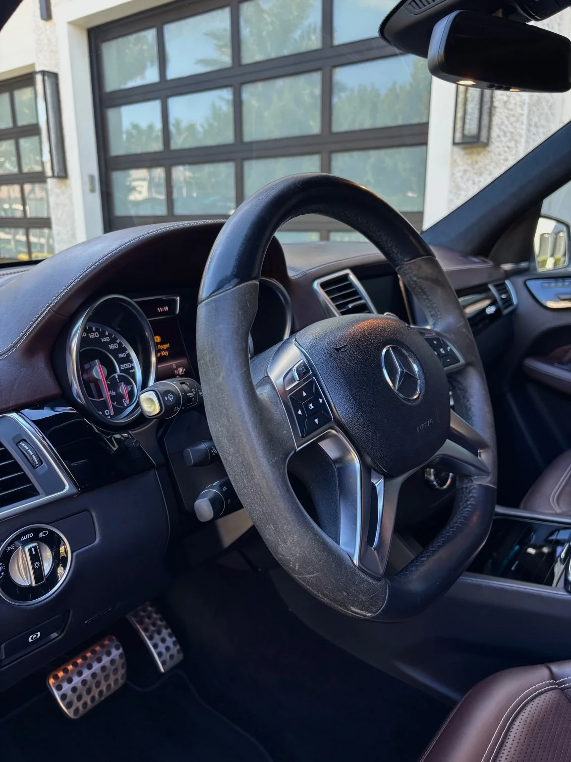 Detailed Mercedes steering wheel and dashboard after interior car detailing service in North Naples FL