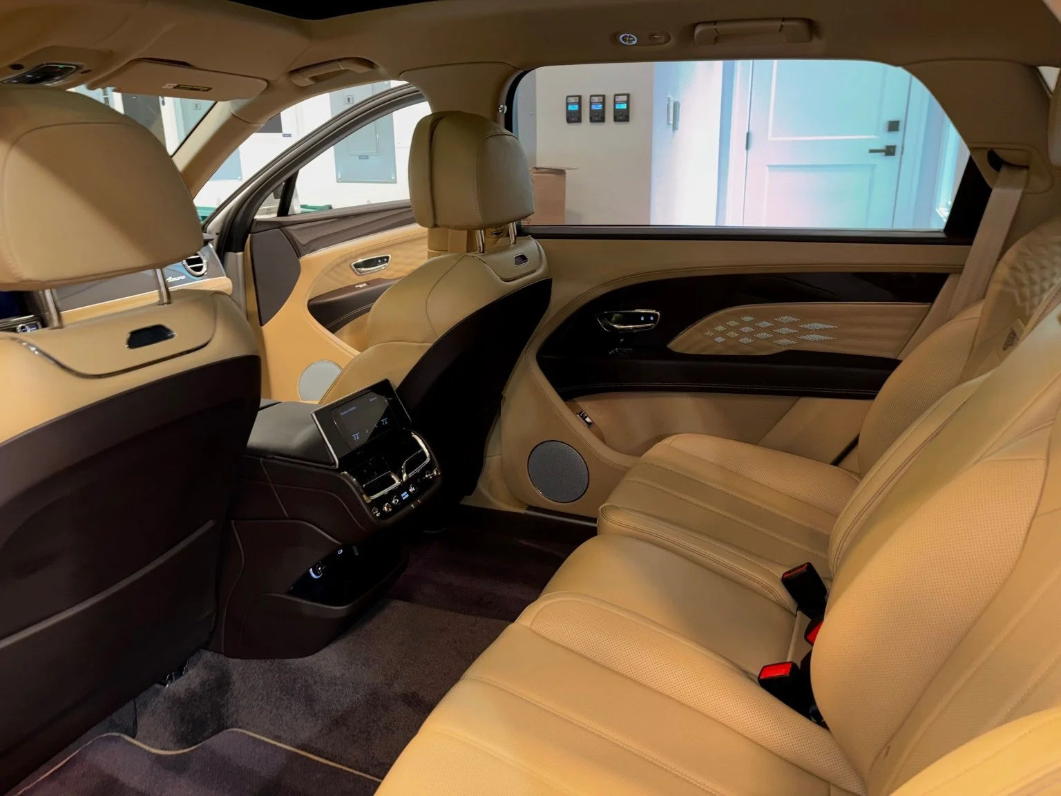 Rear passenger seats of Bentley Bentayga after professional interior maintenance detailing