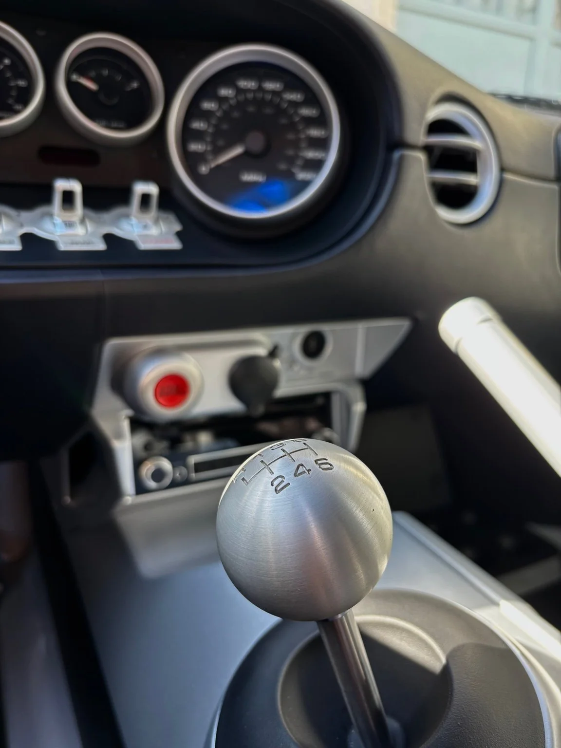 Interior detailing service in Naples FL – detailed cleaning of center console and controls