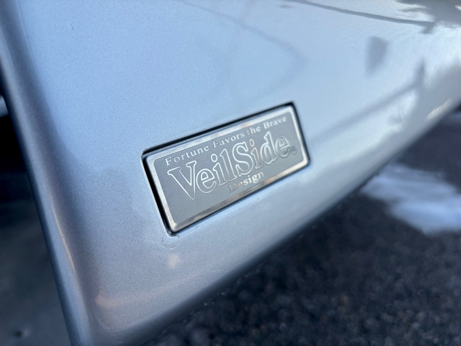 Exterior car detailing service in Naples FL with detailed custom vehicle trim and polished paint finish.