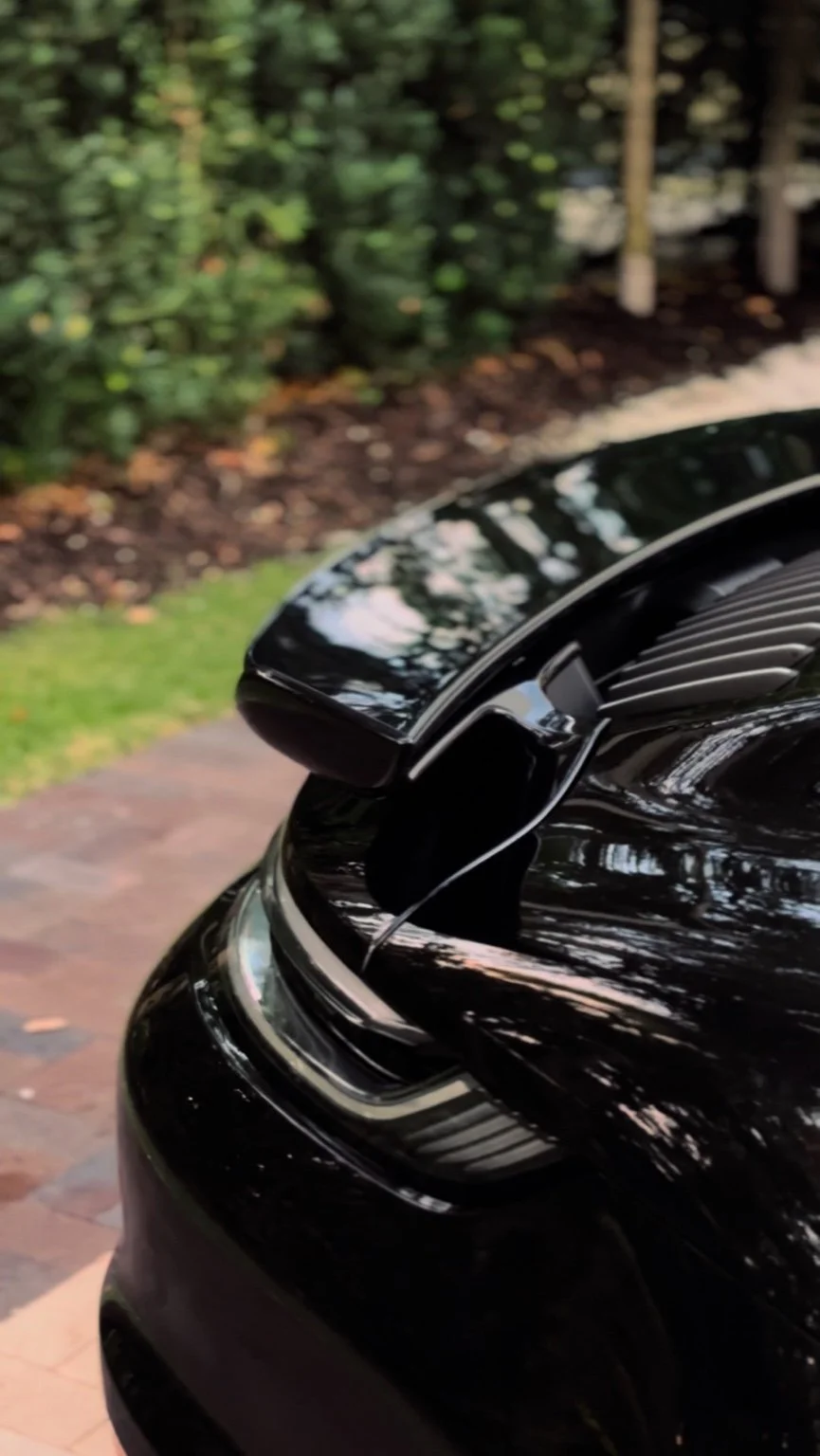 Porsche 911 Turbo S rear spoiler and taillight after premium car detailing service in Naples FL