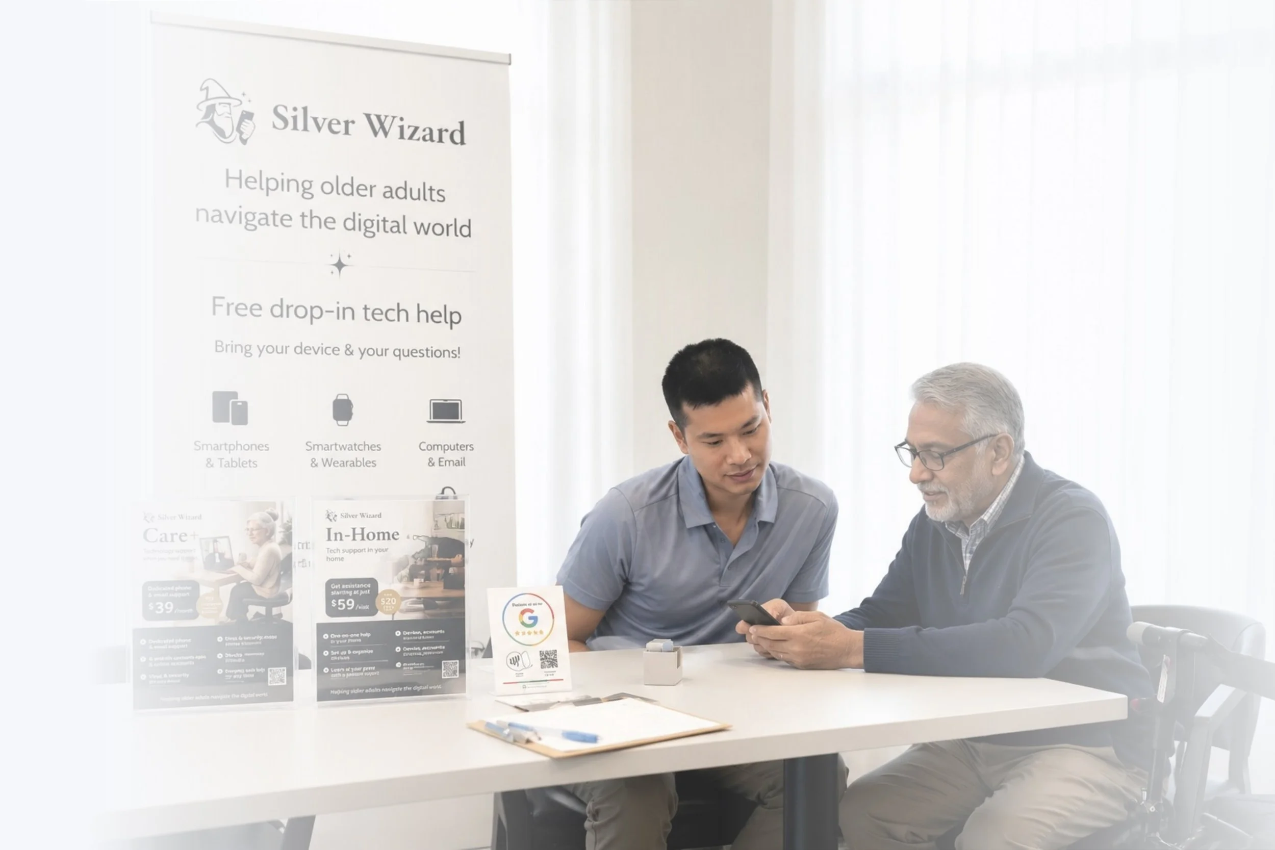Two men sitting at a white table looking at a smartphone in a room with white curtains. A vertical banner with the logo 'Silver Wizard' and information about tech help for seniors, including icons of phones, smartwatches, computers, and email, is on the left side.