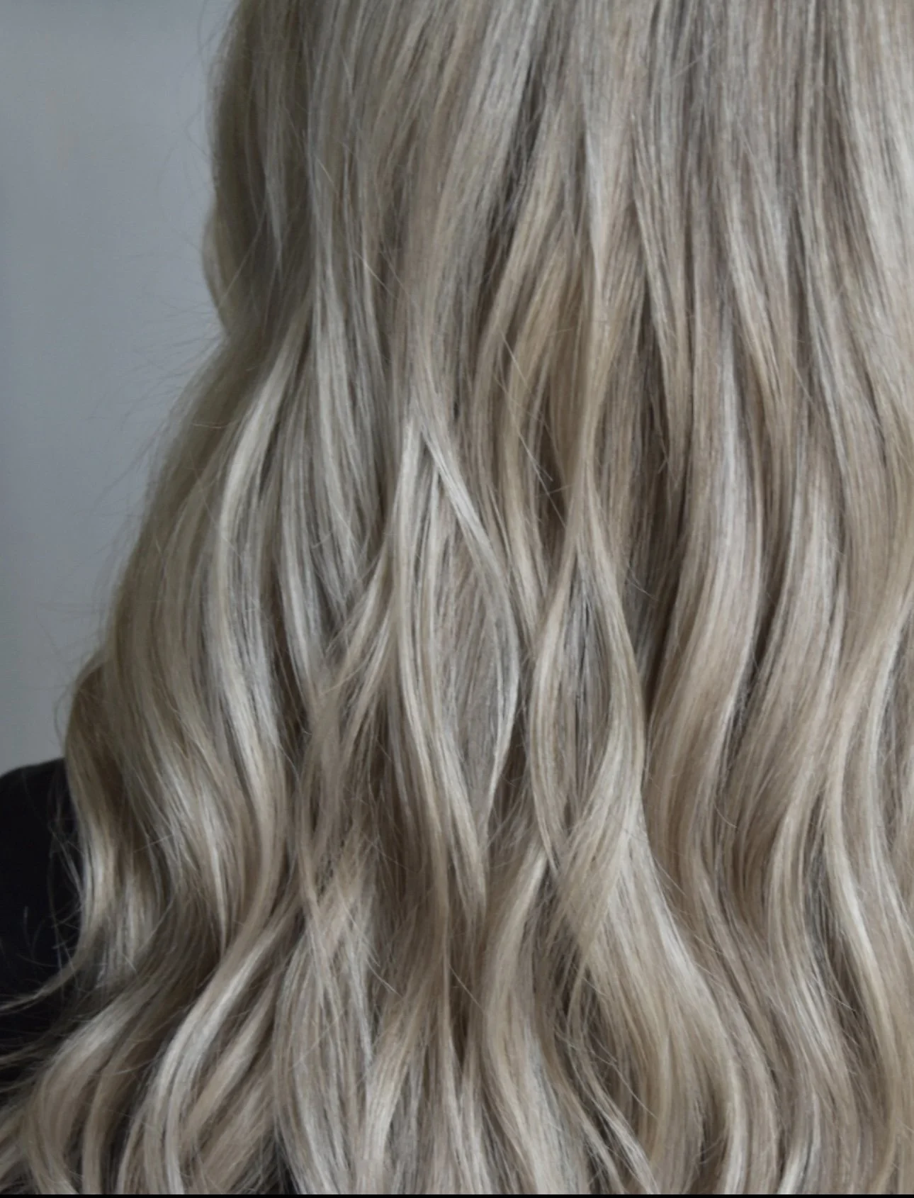 Close-up of blonde wavy hair.