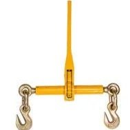 A yellow overhead crane with two hooks hanging from it.