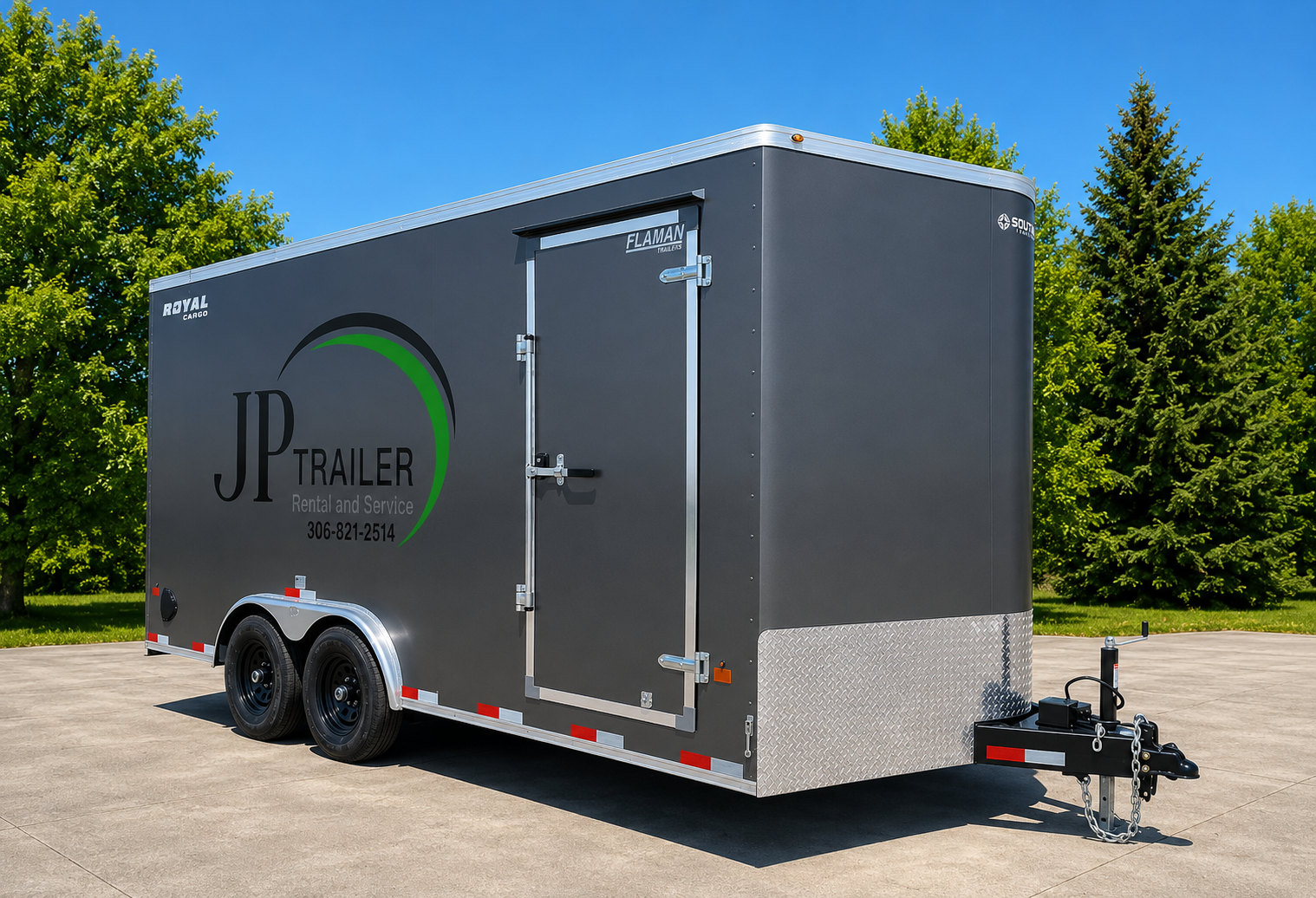 Black enclosed trailer with JP Trailer logo, parked on concrete surface with green trees in the background under a clear blue sky.