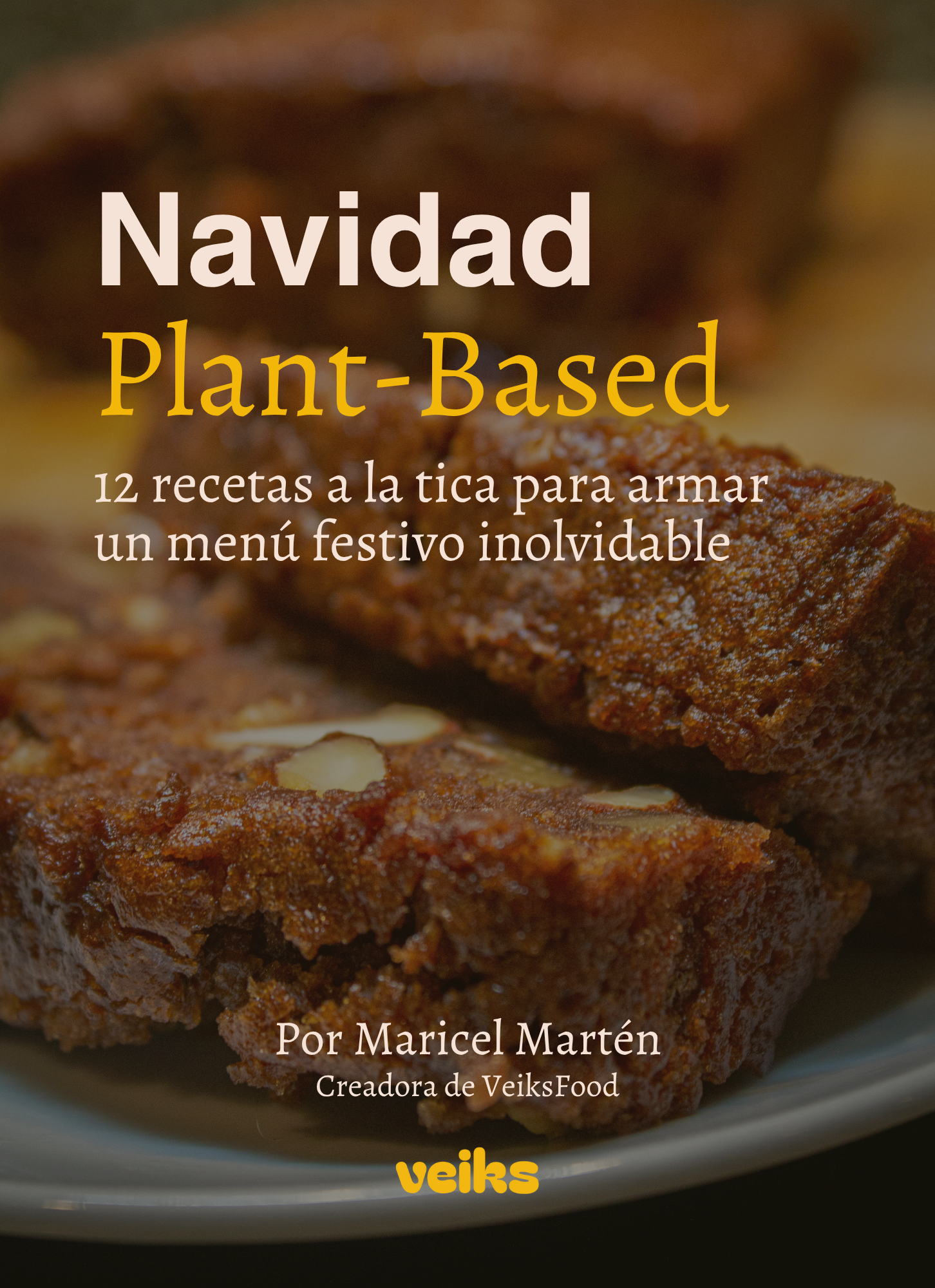Queque Navideño. Título del libro 'Navidad Plant-Based', escrito por Maricel Martén, creadora de VeiksFood. Texto adicional: 12 recetas a la tica para armar un menú festivo inolvidable. Logo de Veiks en la parte inferior.