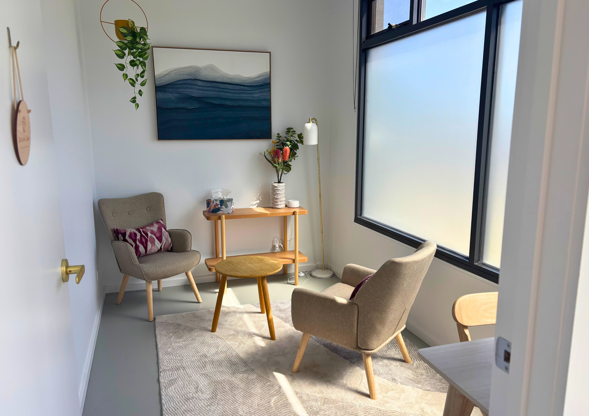Holistic OM Queenscliff Psychology Room with window, chairs and table
