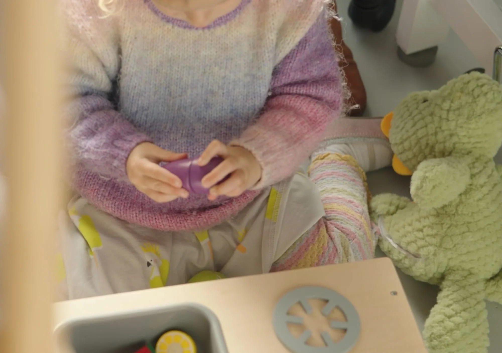 Young child playing with toys