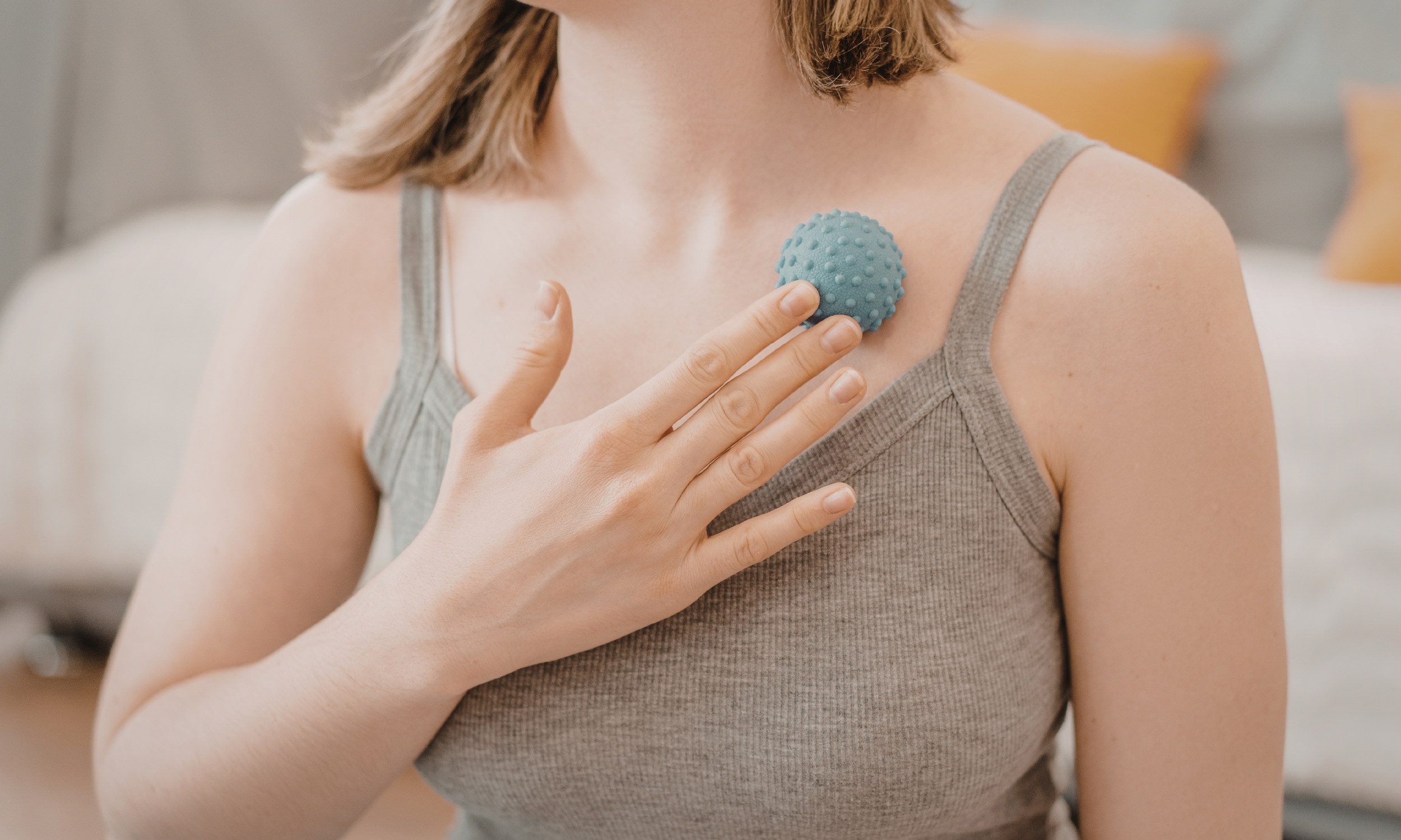 Self-massage using a therapy ball to relieve shoulder and chest tension