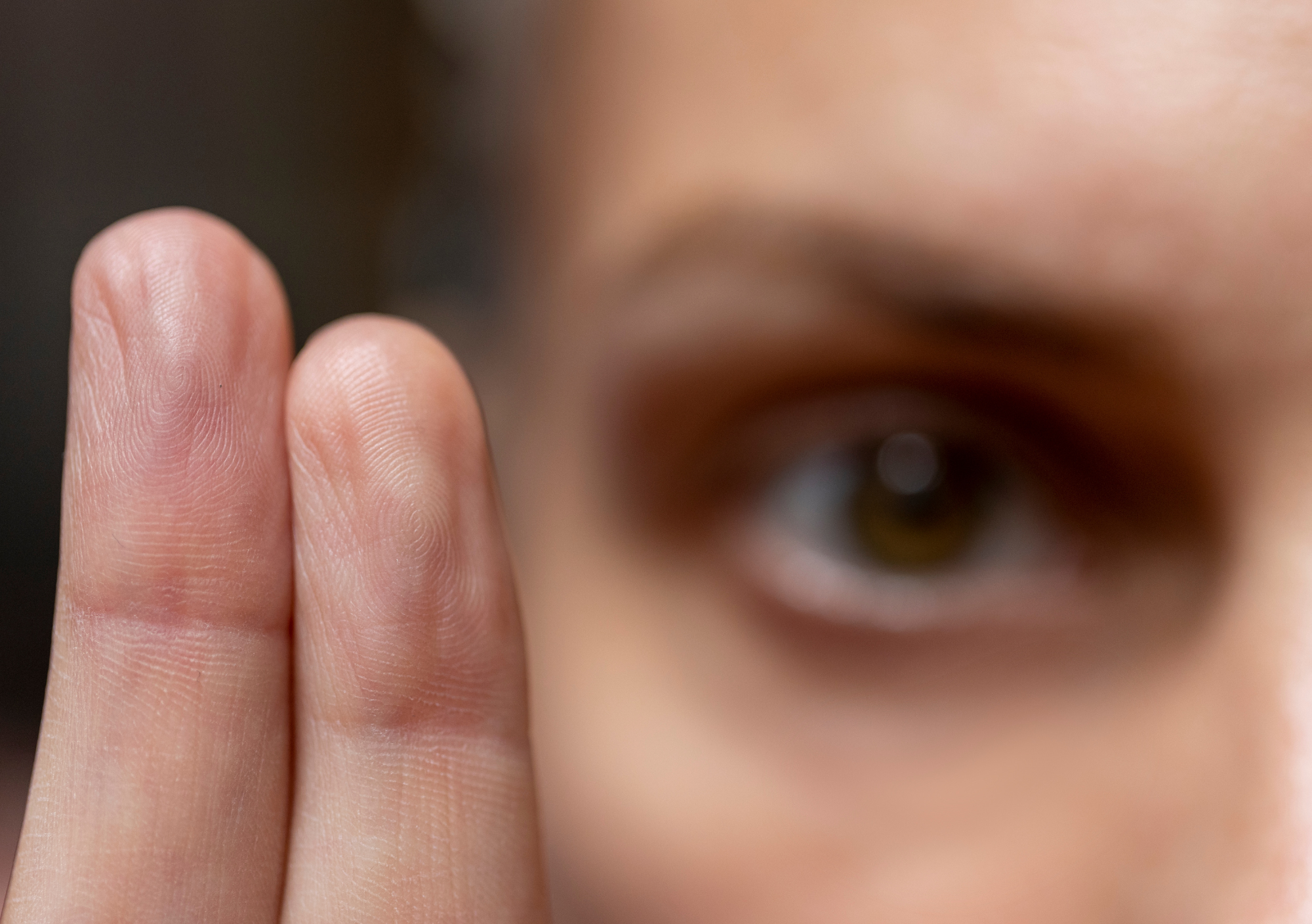 Psychologist holding two fingers for EMDR Therapy Holistic OM Geelong